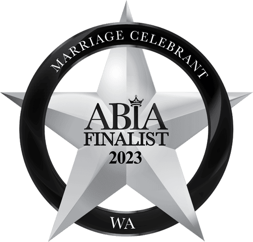 A badge celebrating marriage, featuring a silver star with a black circle around it. The circle has the text 'Marriage Celebrant' at the top and 'WA' at the bottom. Inside the star, it says 'ABIA Finalist 2023' with a small crown above the 'ABIA'.