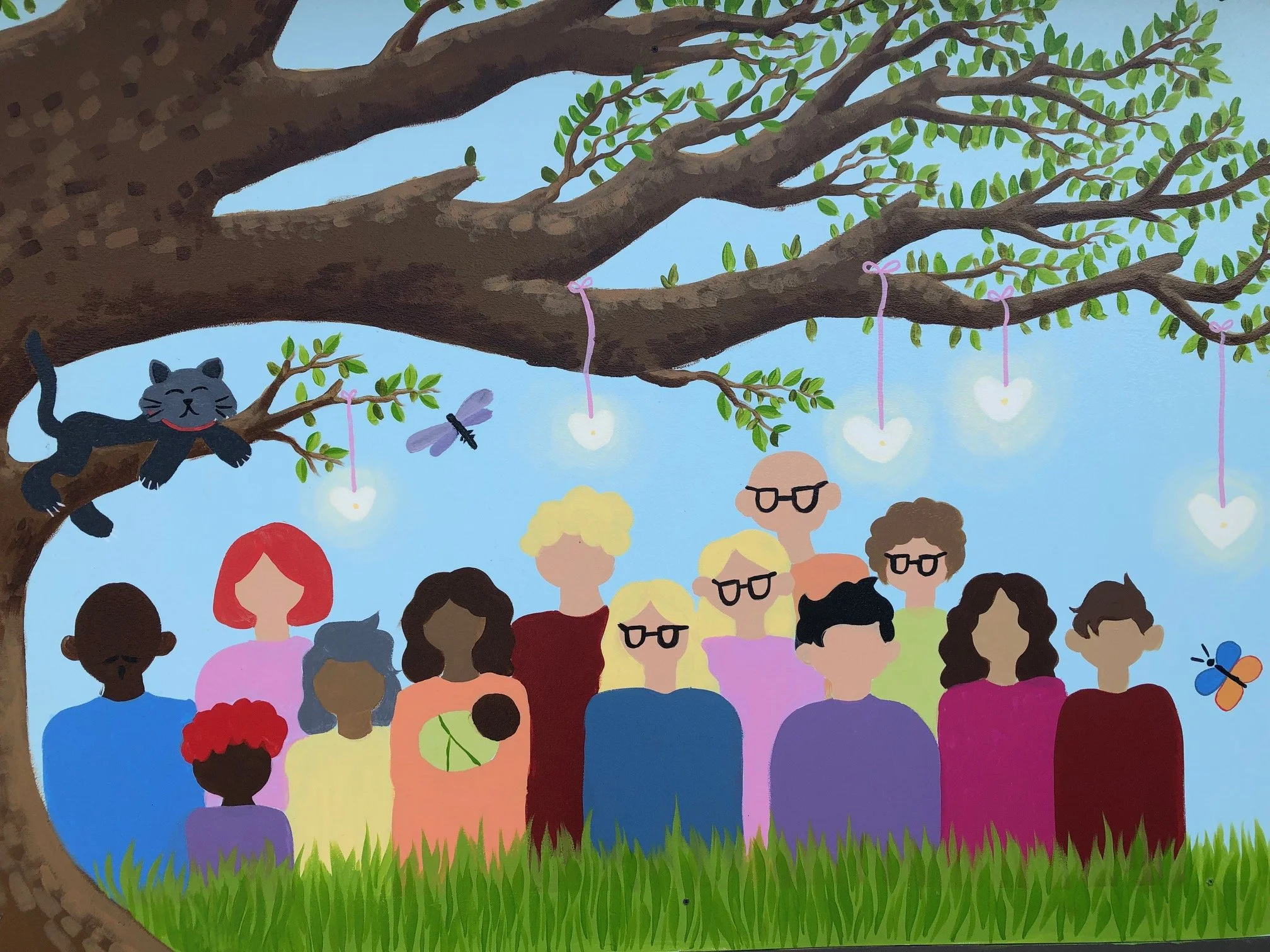 Right side of the Tree of Life mural at Blessingways Family Wellness in Airdrie, Alberta, featuring families and individuals of varied backgrounds reaching toward the vibrant Tree of Life.