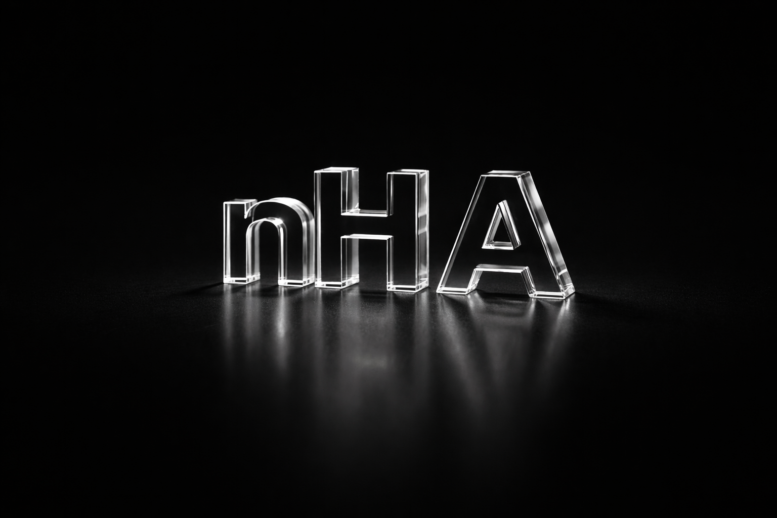 The word 'nHA' spelled out in transparent glass letters on a black background with reflections.