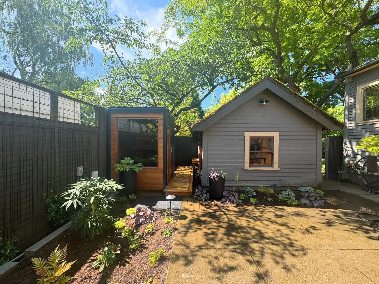 Seems like forever ago we did this little background retreat. 
•
This one packed it all in: a new sauna, a sweet little outdoor shower, new back deck, stairs, and landing, a gorgeous metal pergola designed by my crew Leah, more trellises, update