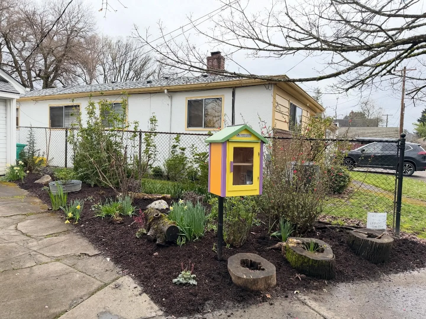 No before pictures, and a tough garden bed to photograph, but all the little details came together nicely. 
&bull;
It just takes a few shrubs, a bunch of divided ferns, a handful of Heuchera, two big rocks and a couple of nurse logs to give this litt