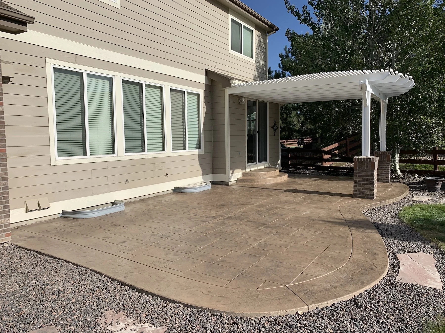 Long-lasting, low-maintenance stained concrete patio in Denver backyard