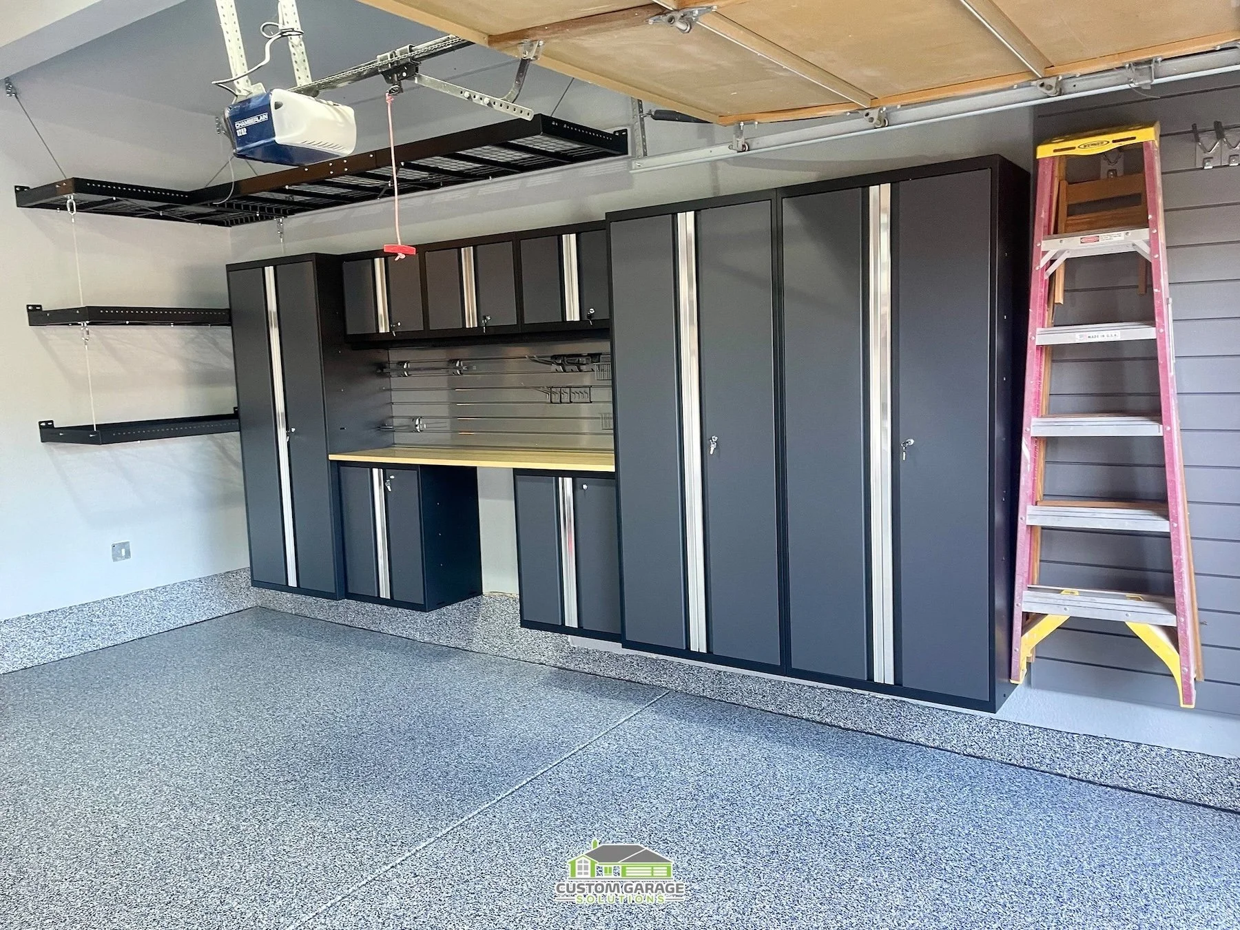 Organized Colorado garage with baseball, softball, lacrosse, soccer, golf, and track gear