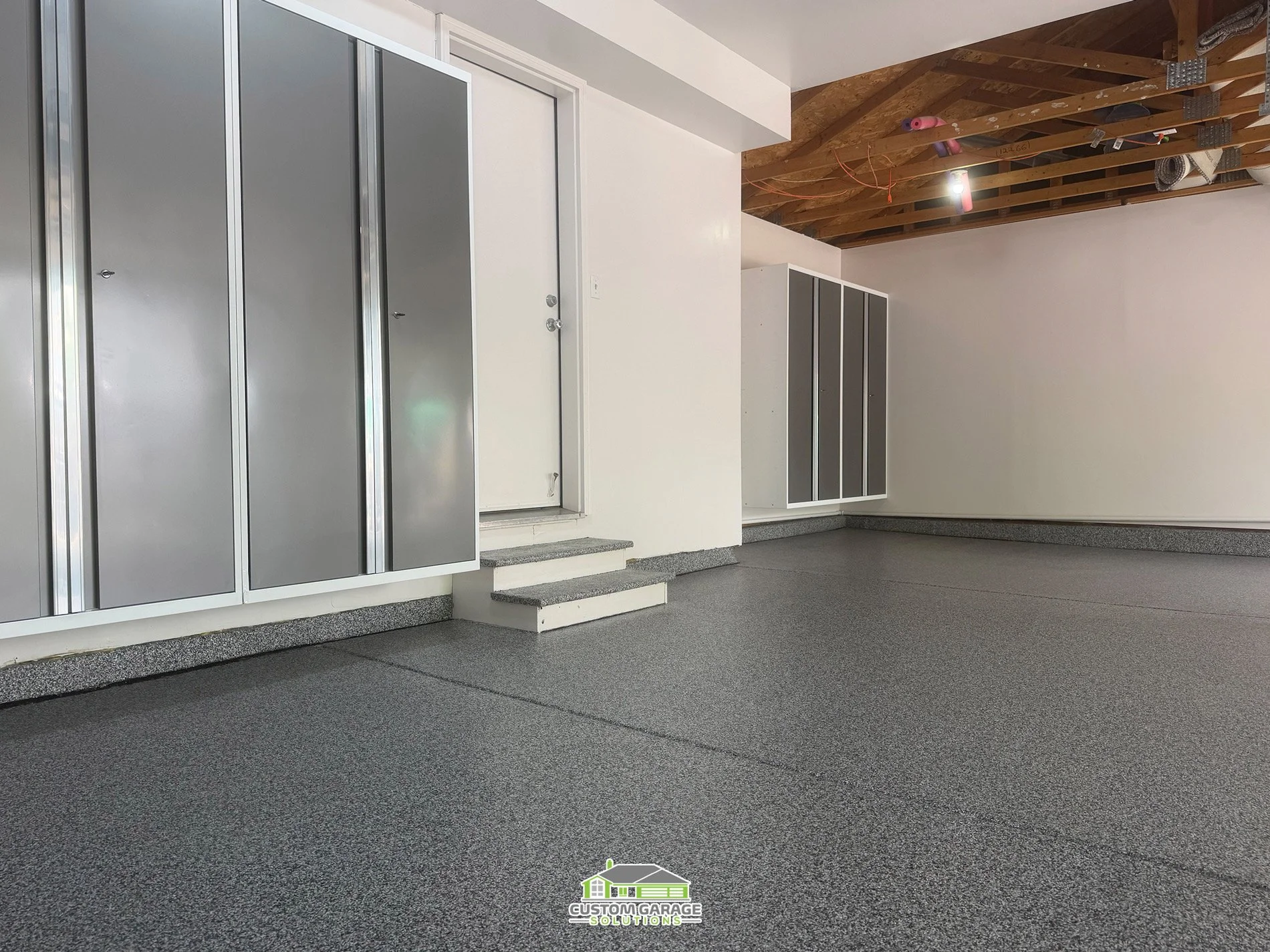 Colorado Garage Remodel - Flooring and mounted cabinets off the ground