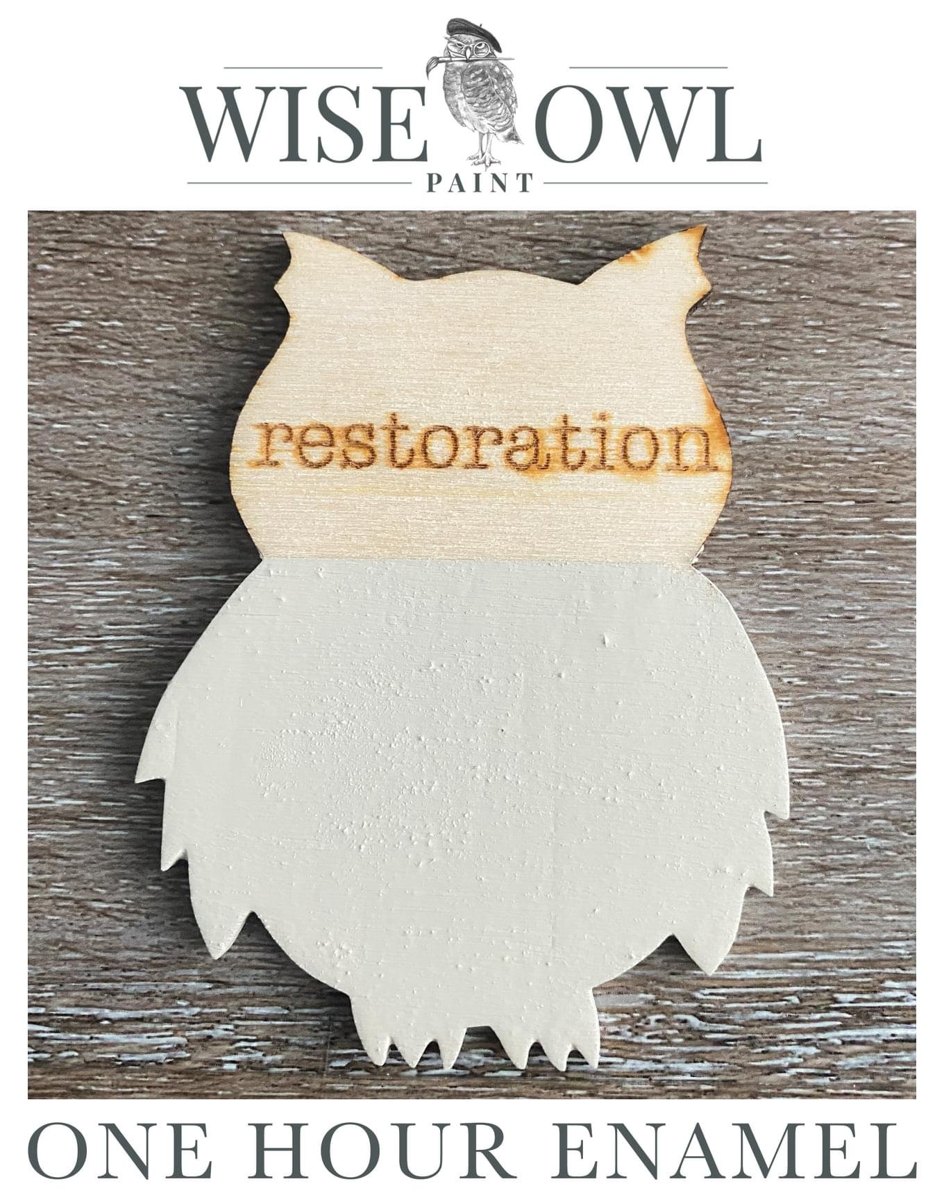 A decorative wooden ornament in the shape of an owl with the word restoration burnt into the top half, and a white, textured bottom half, sitting on a wood surface, with the text Wise Owl Paint and One Hour Enamel above and below.