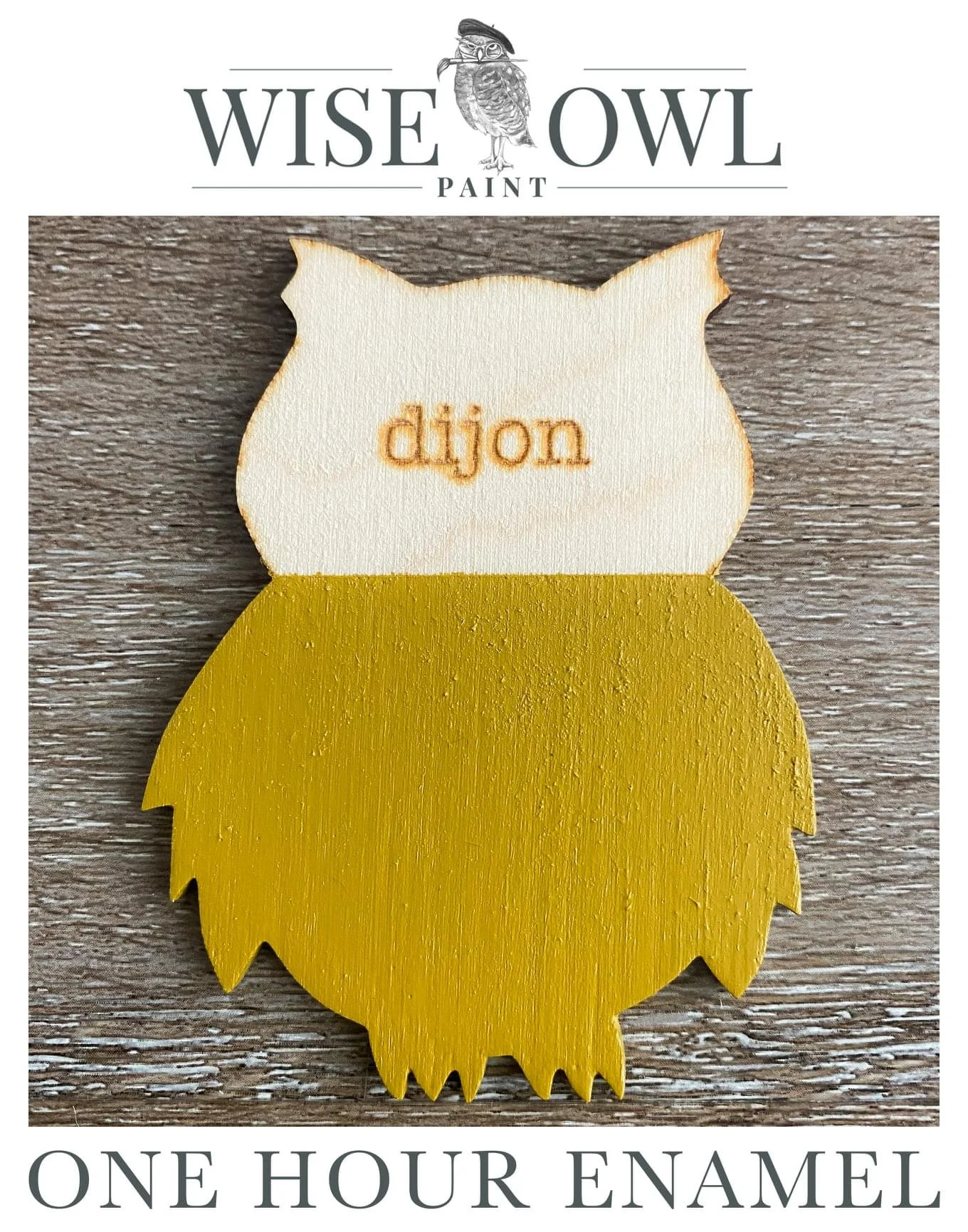 A wooden owl-shaped sign painted yellow with a white head featuring the word 'dijon' engraved in the center.