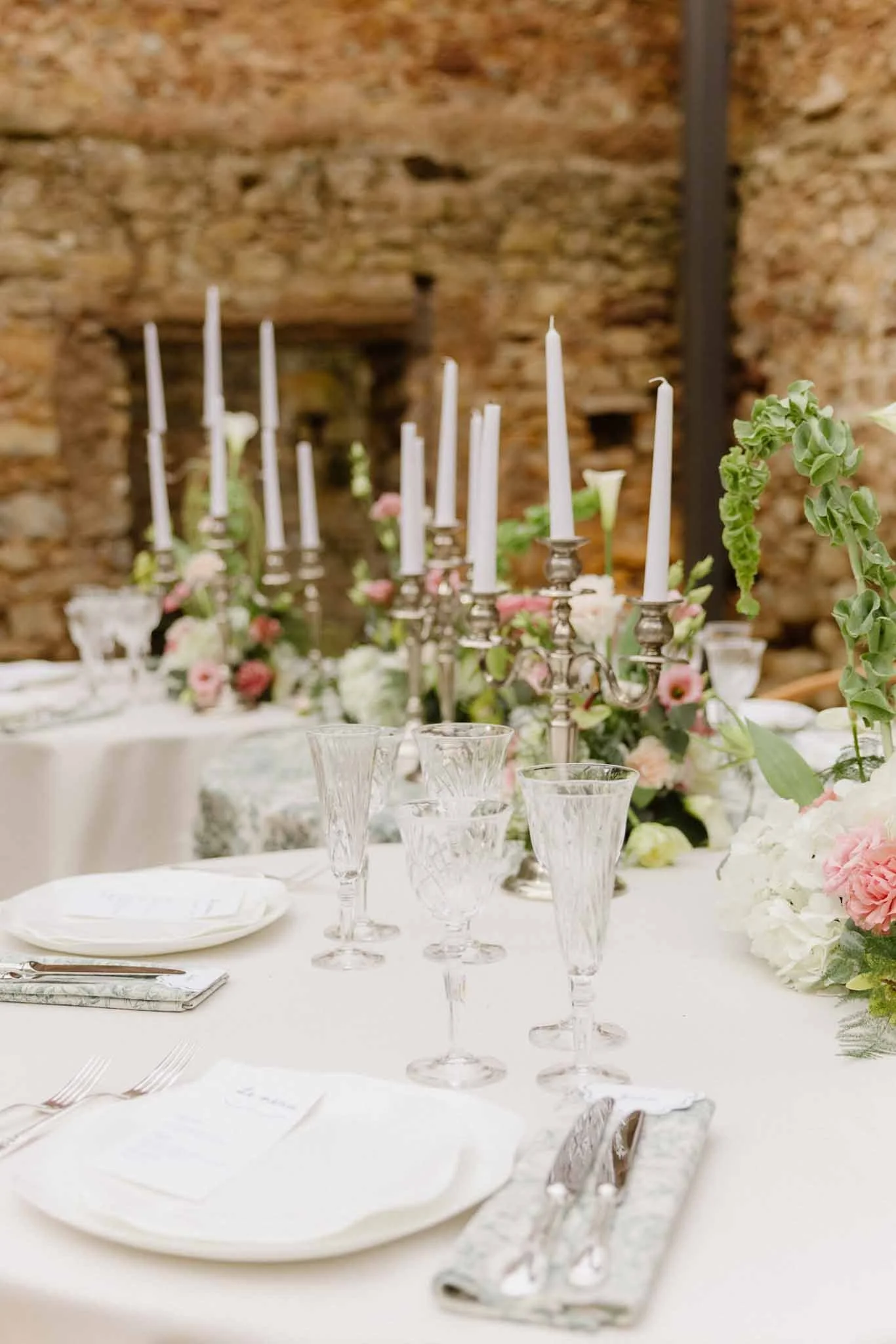 Chateau-du-Pont-Bourget-Lina-Bernard-detail-shot-reception-table-flower-centerpiece-candles-silverware.jpg