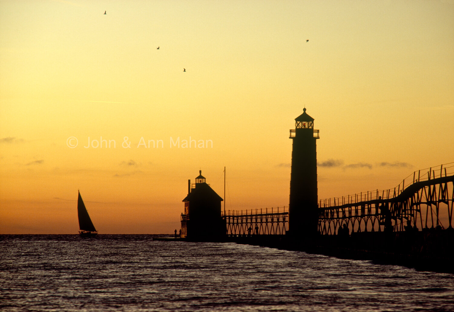 ID_30-1030B Sailboat and Grand Haven South Pier Lights at Sunset