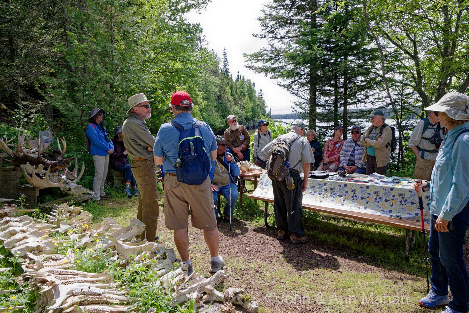 Dr. Rolf Peterson speaking to group at the Wolf-Moose research station
