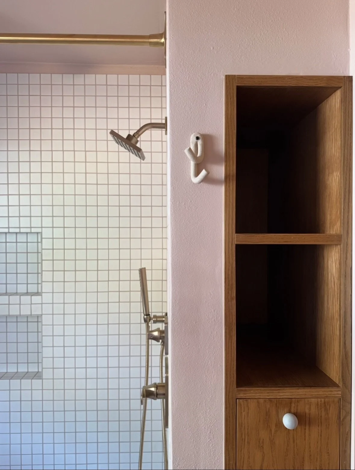 We recently finished the 1956 ranch bathroom remodel and are excited to share some of the details! We packed a lot of change into this small space starting with converting their hallway closet to a custom bathroom built-in. The built-in features extr