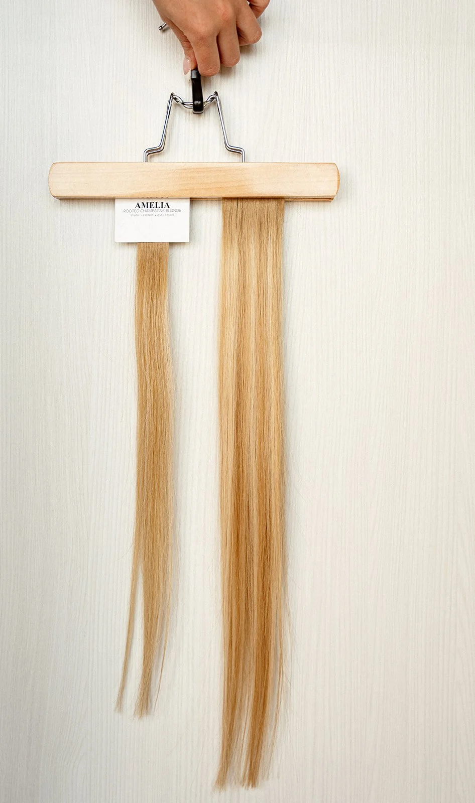 Hair extension on a hanger.