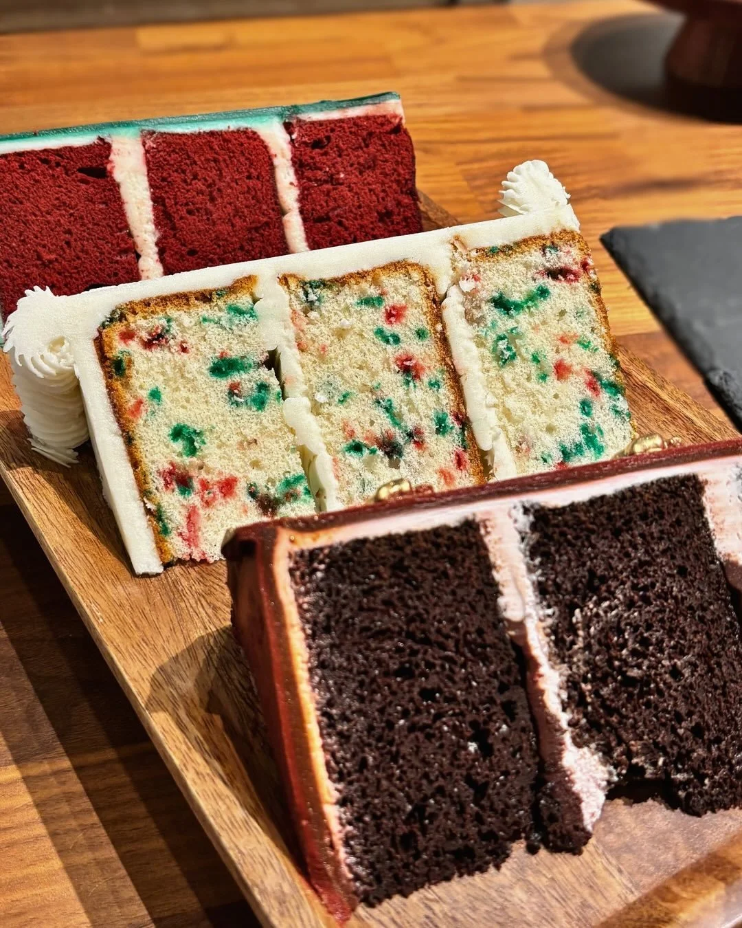 Sneak peek at our December cakes 👀 they&rsquo;ll be available for preorder soon, but until then you can pick up a slice for a special price!!

This weekend only, these holiday cake slices will be available for just $4!! 🎄🎁