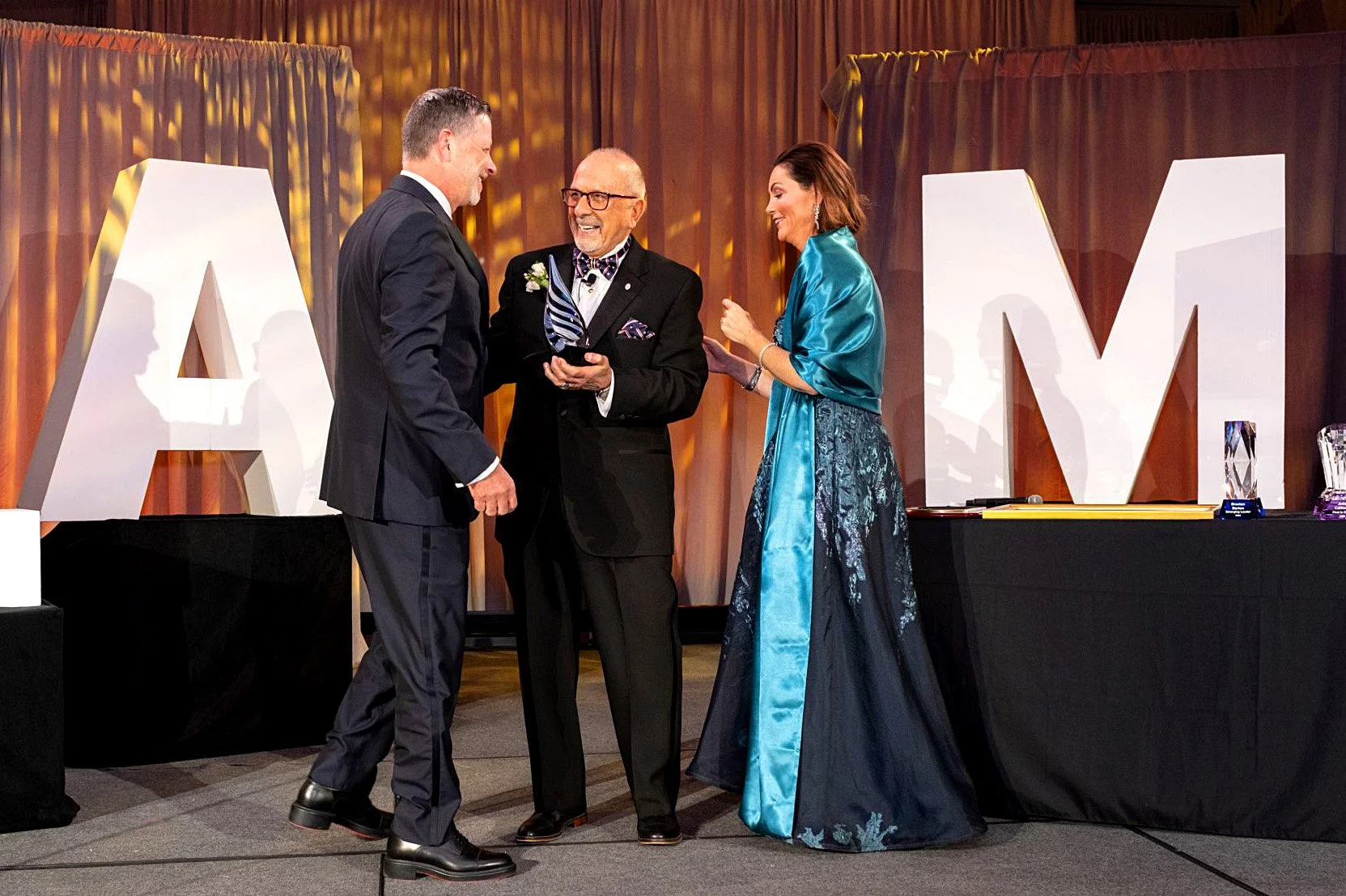 Frank Scalese receiving the Finseca Robert Bacci Baccigalupi Lifetime Luminary Award on stage