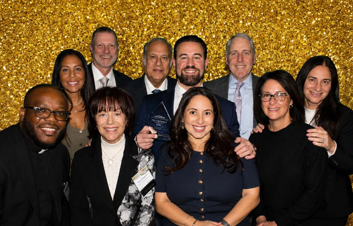 ohn T. DeMarinis II and Blue Ocean Wealth Solutions team members celebrating the Long Island Business News 2025 Leaders in Business and Finance award