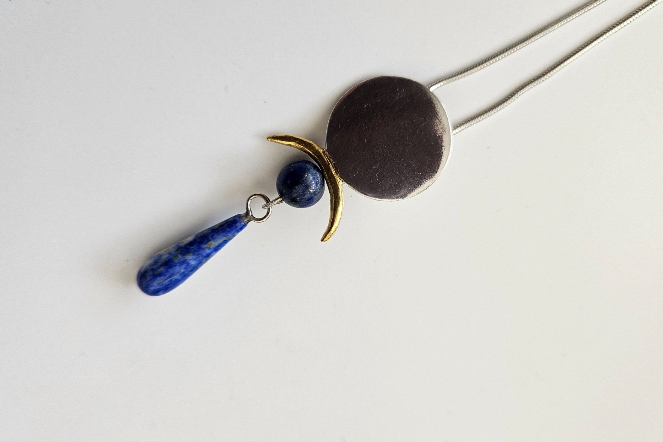 Per SaRa Hathor's Mirror pendant. Fine Silver, handmade and hallmarked. Lapis Lazuli stones.