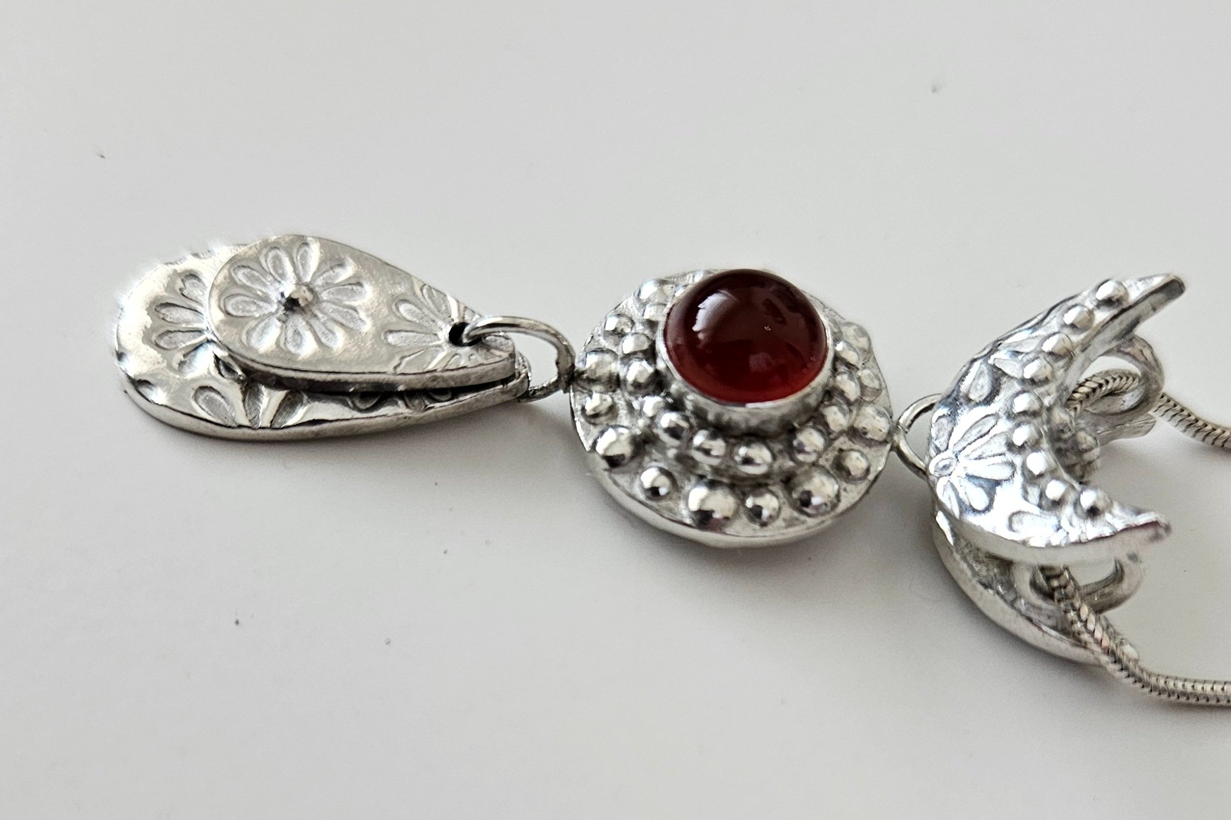 Per SaRa Wife of Ra pendant. Fine silver with carnelian inset stone.