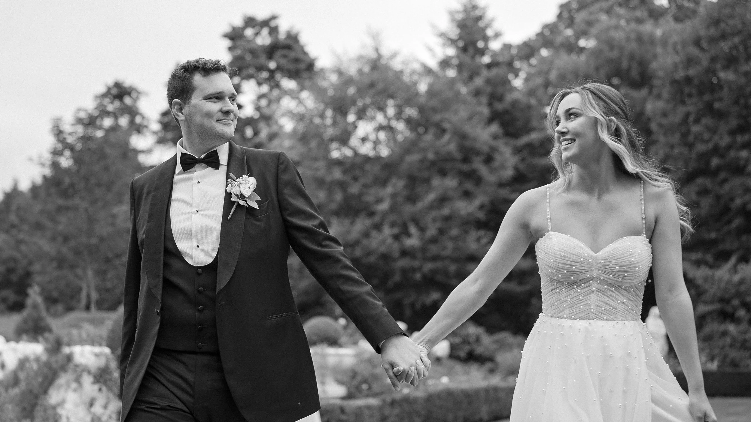 tinakilly-house-wedding-couple-walking-gardens.jpg