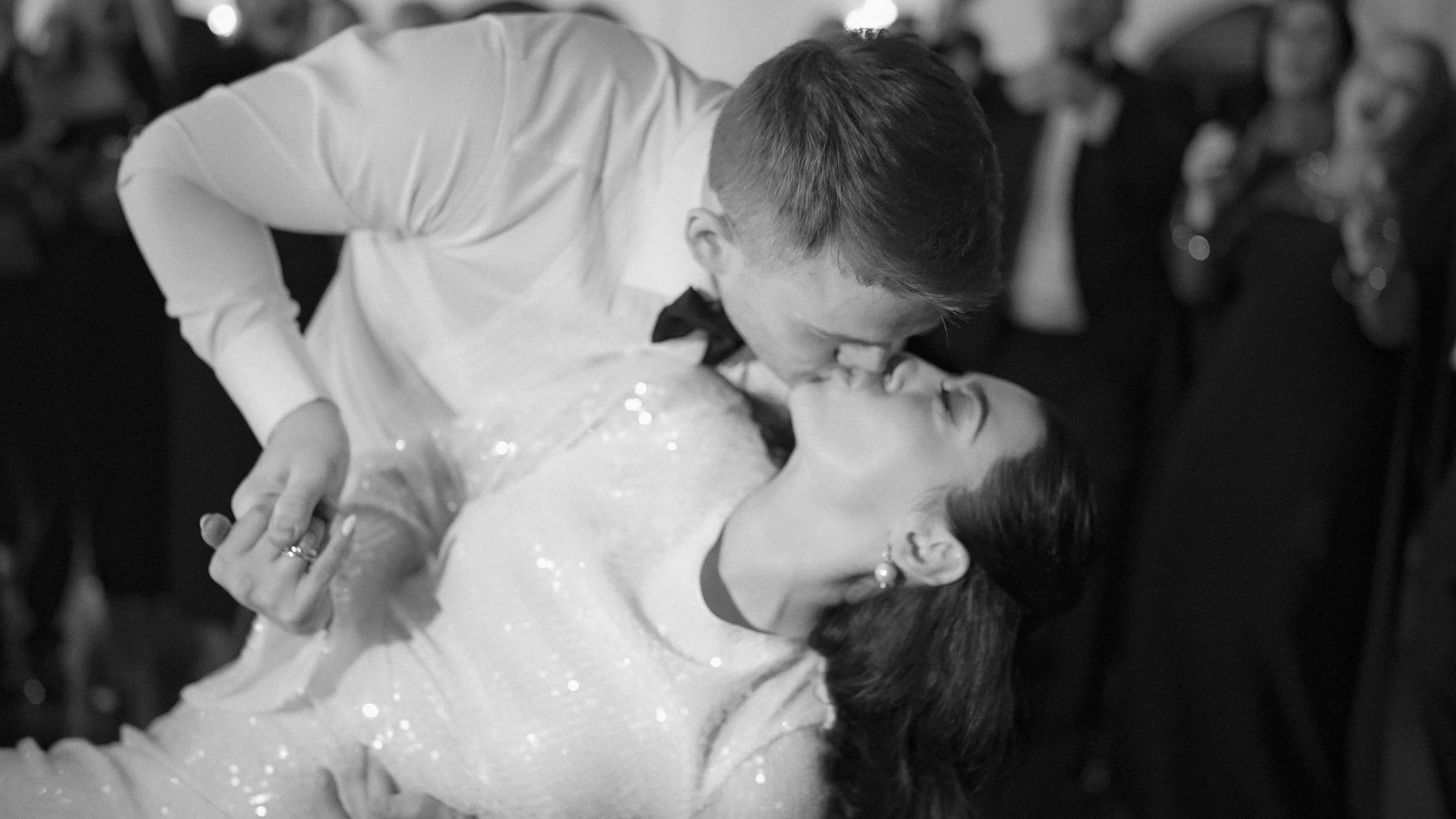 Groom dipping the bride for a kiss during their first dance at Kilkea Castle, black and white