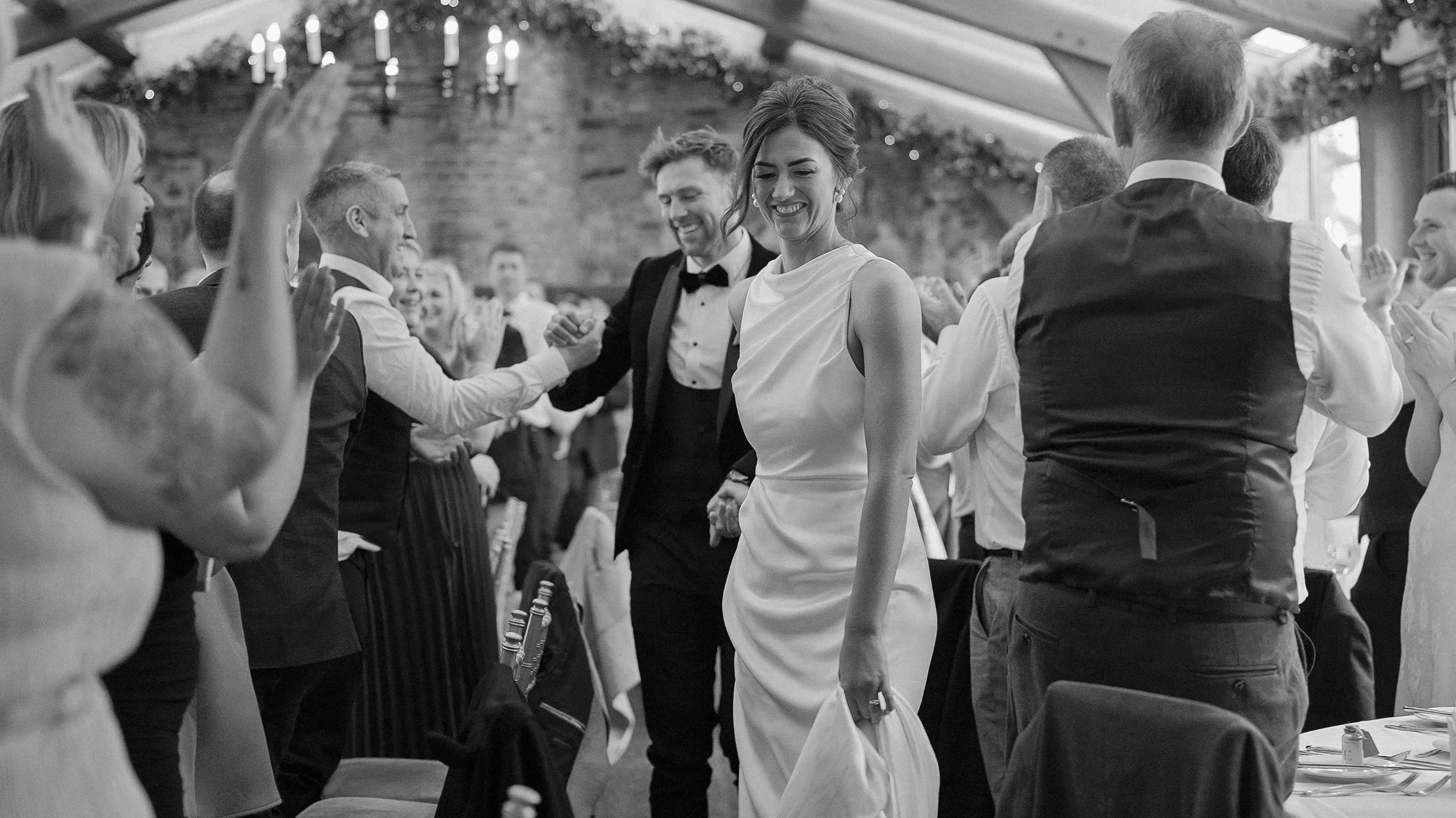 Guests applauding as the bride and groom enter the Banquet Hall for dinner at Barberstown Castle