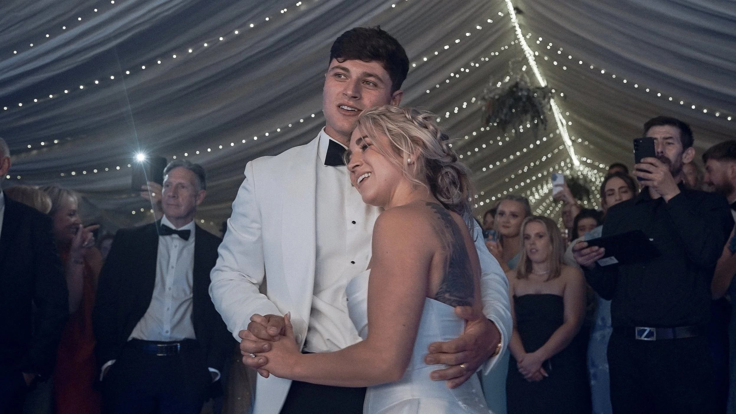 First dance under fairy lights in a wedding marquee on The Curragh, Co. Kildare