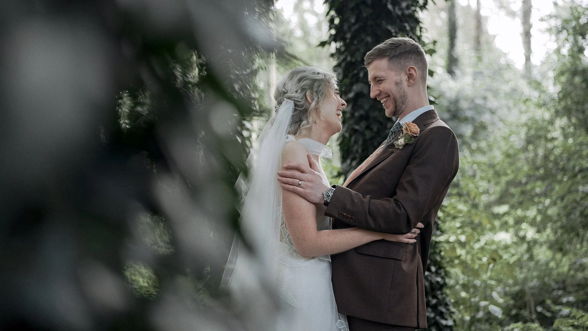 Nicola and Conor laughing together in the woodland at the Station House Hotel, Co. Meath