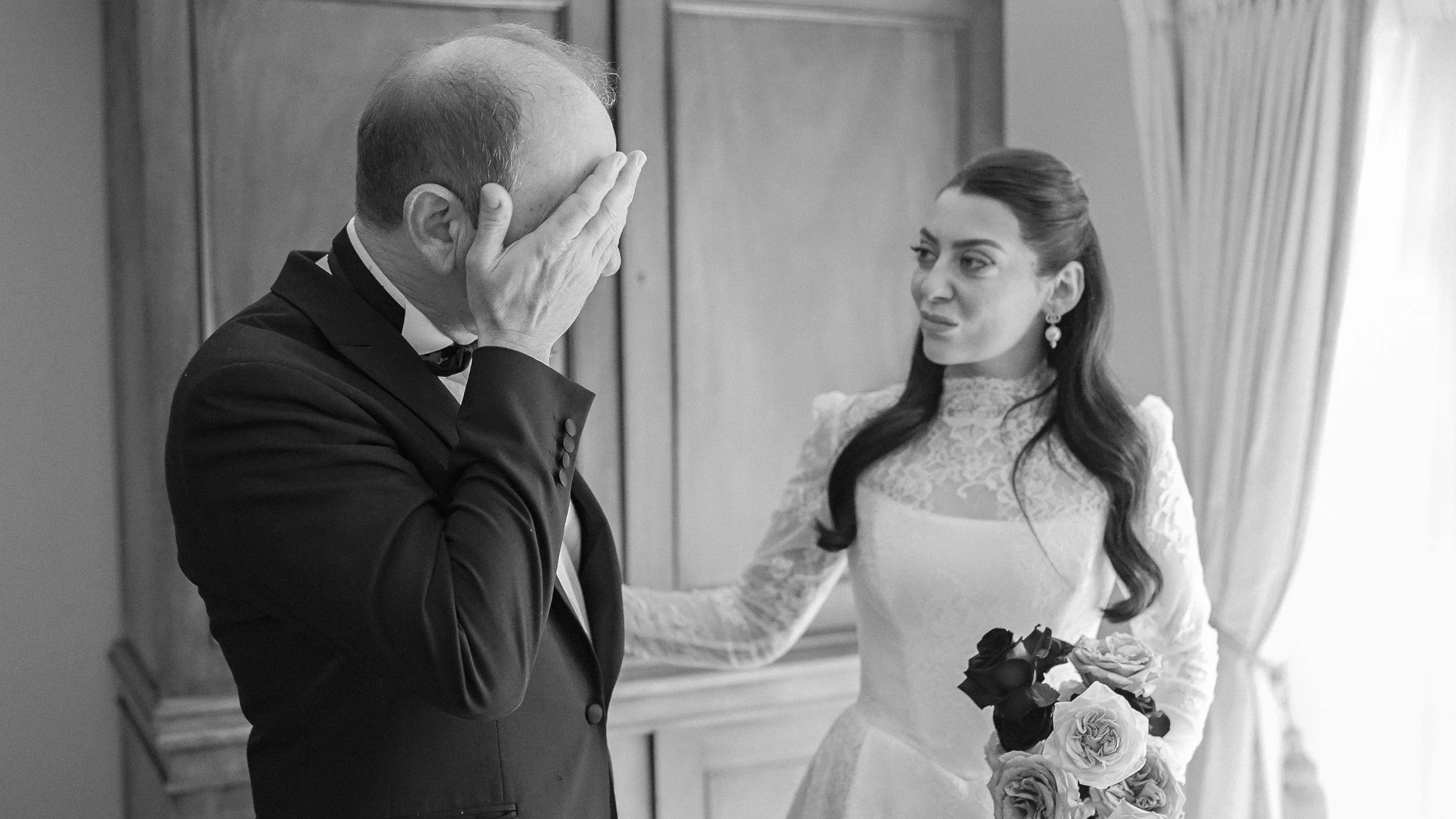 Emotional father of the bride seeing his daughter in her lace wedding dress at Kilkea Castle