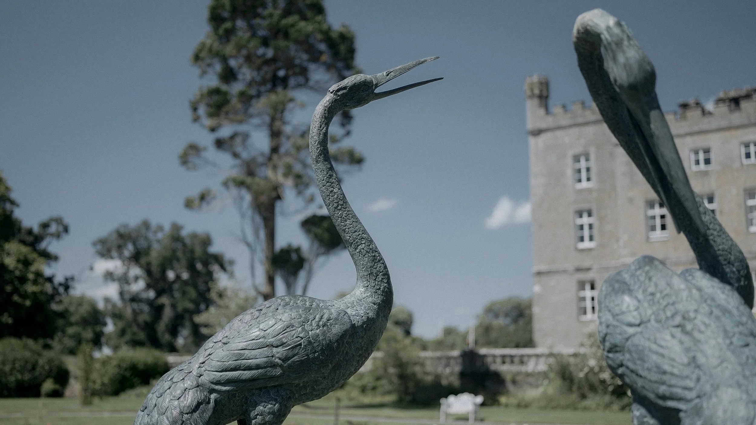 Bronze heron statues in the gardens of Markree Castle, Co. Sligo, with the castle in the background