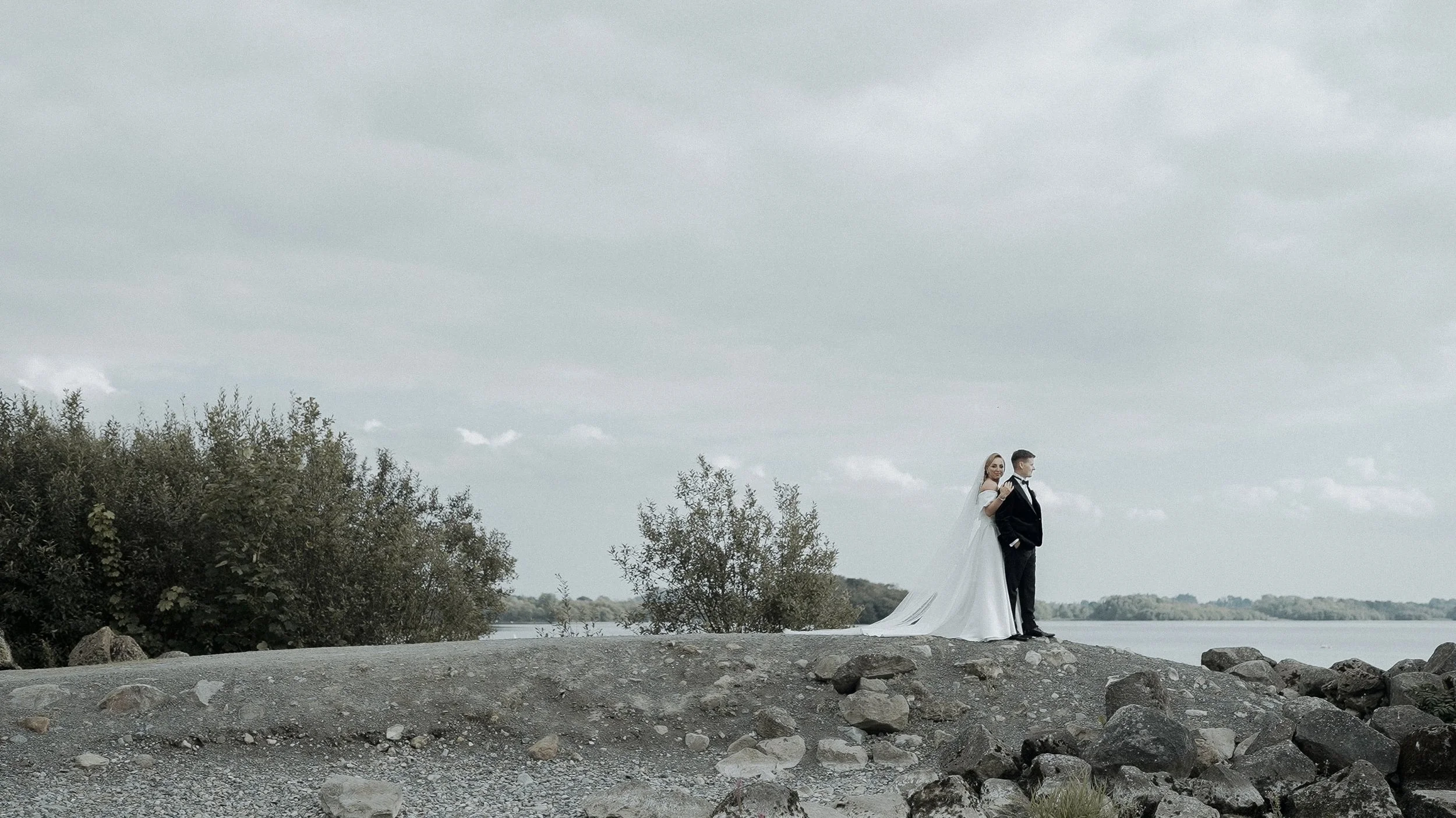 Emma and Damien on the shore of Lough Sheelin after their Crover House Hotel wedding ceremony