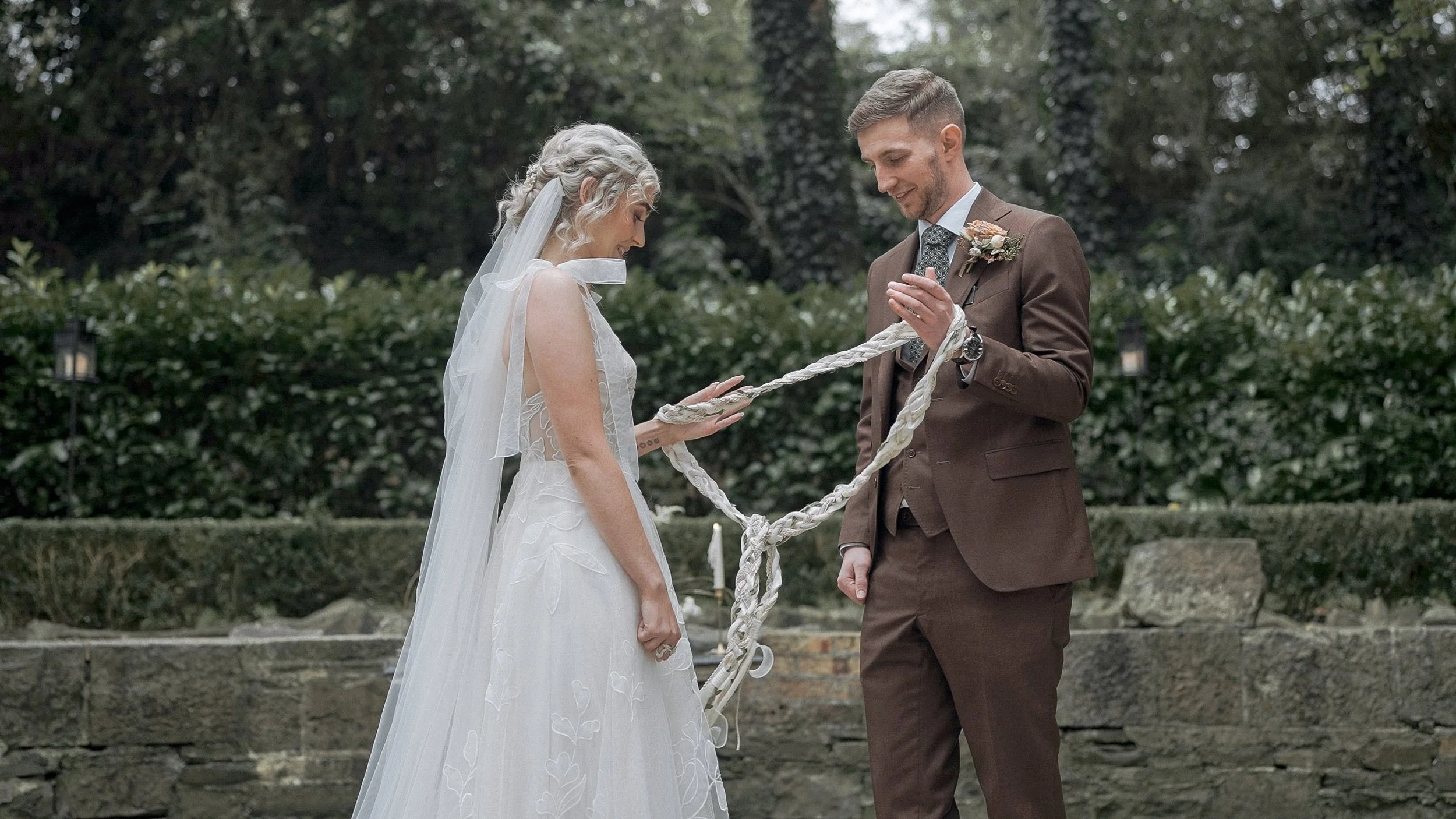 Nicola and Conor's handfasting ceremony in the stone garden at the Station House Hotel, Kilmessan