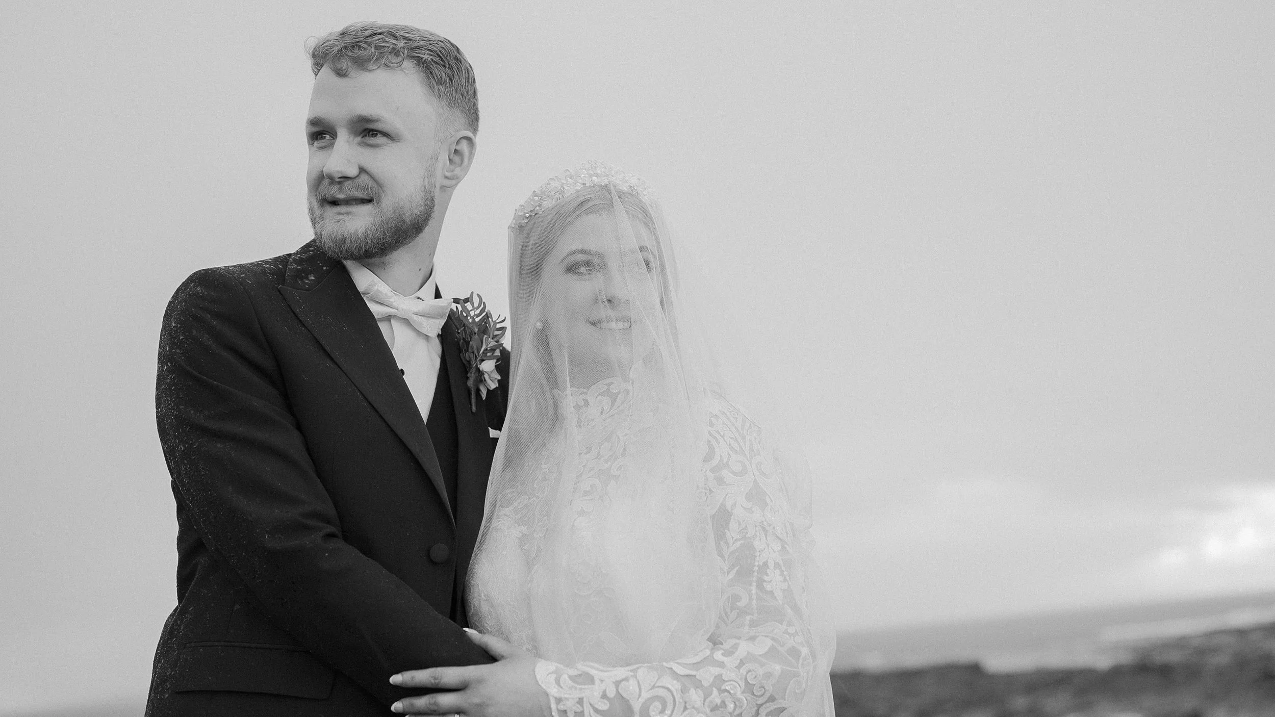 Black and white portrait of Hannah and Francis looking out over the Atlantic at Spanish Point, Co. Clare
