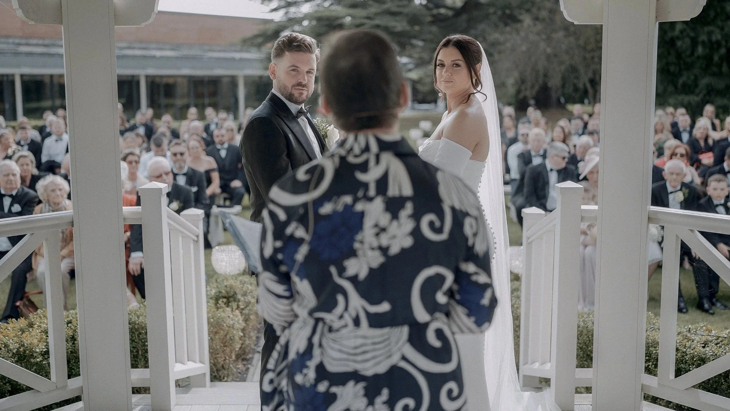 Jennie and Craig during their ceremony in the white gazebo at Farnham Estate, Co. Cavan
