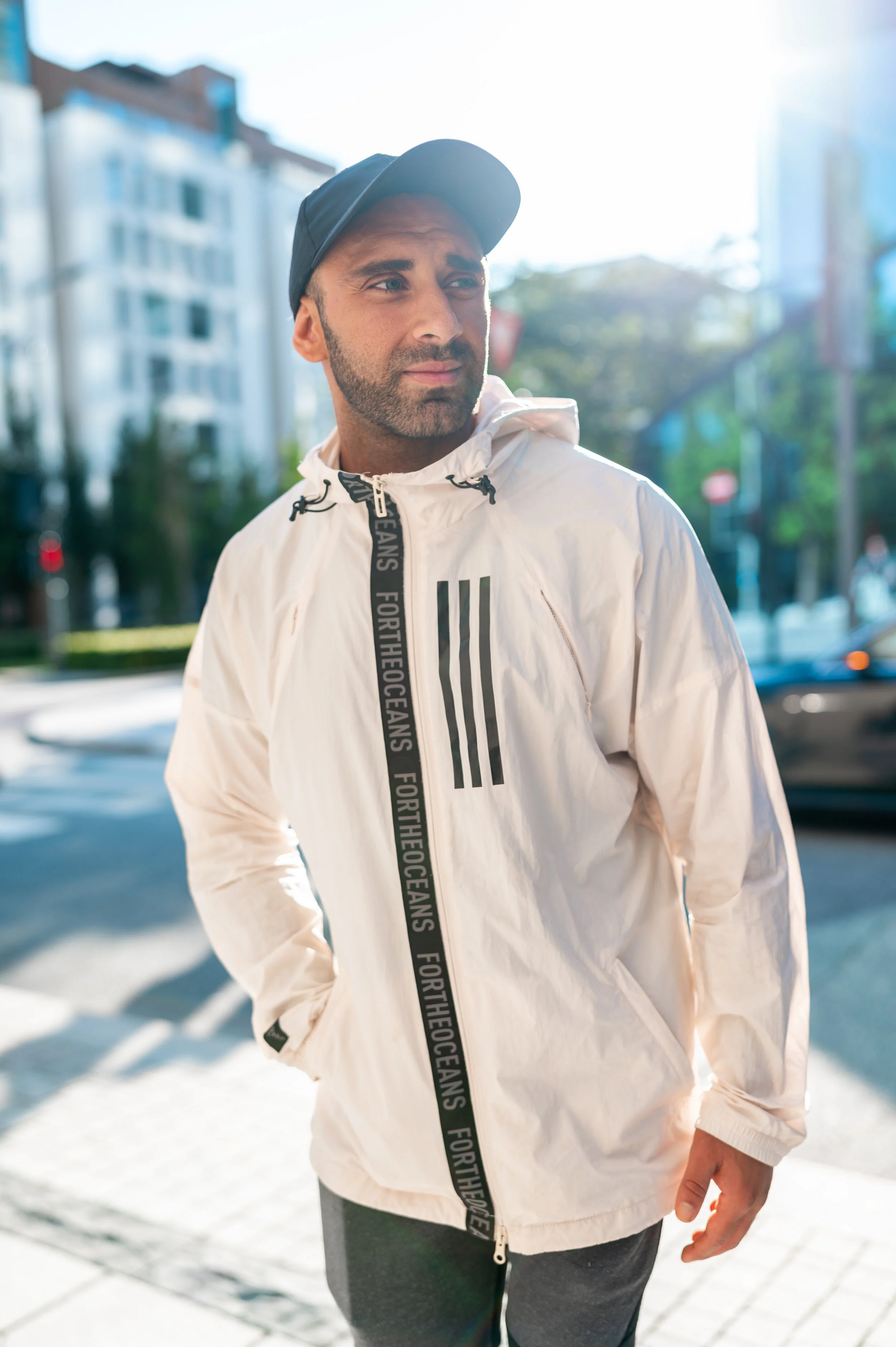 gentleman looking to the side with cap