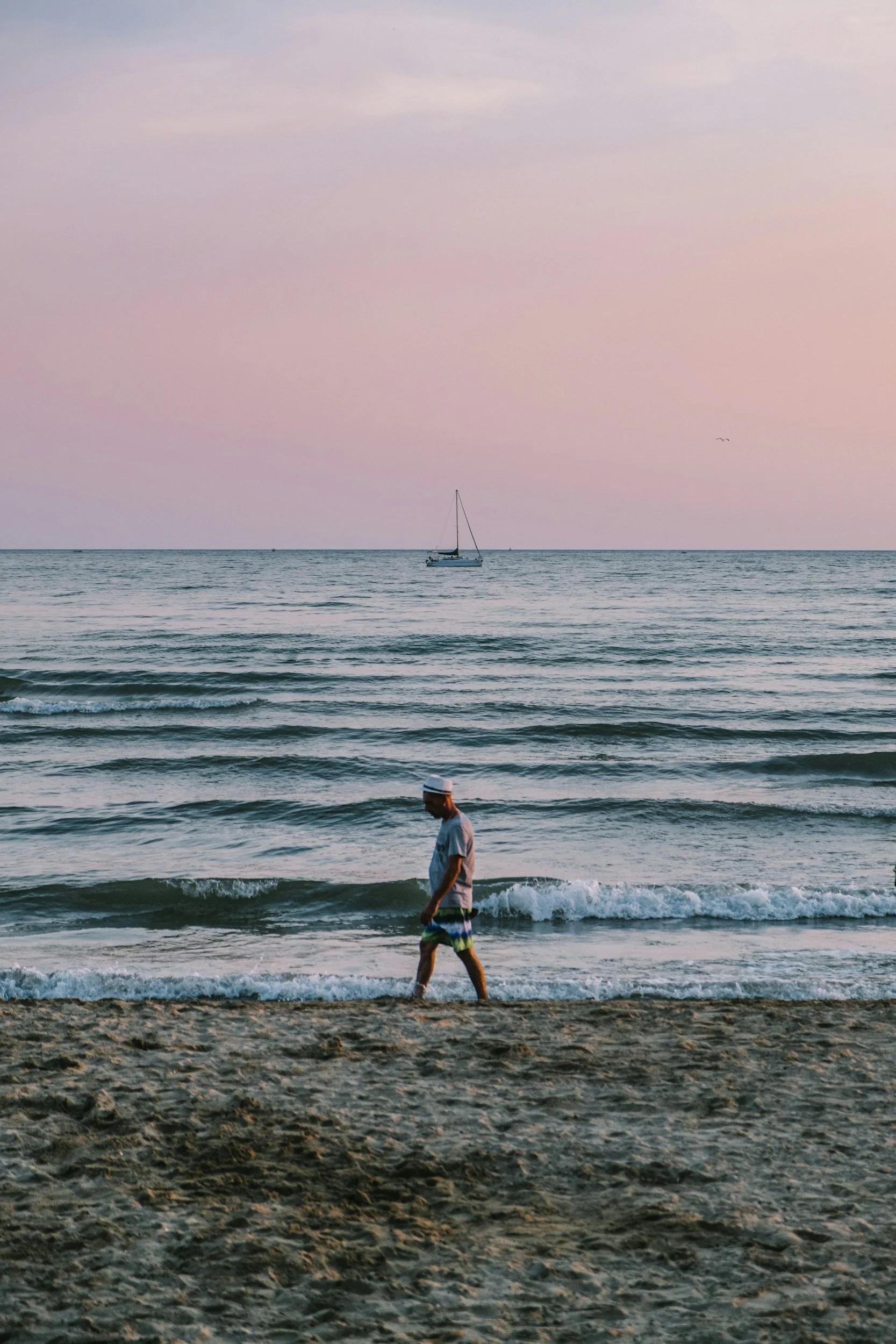 man walking on the beach