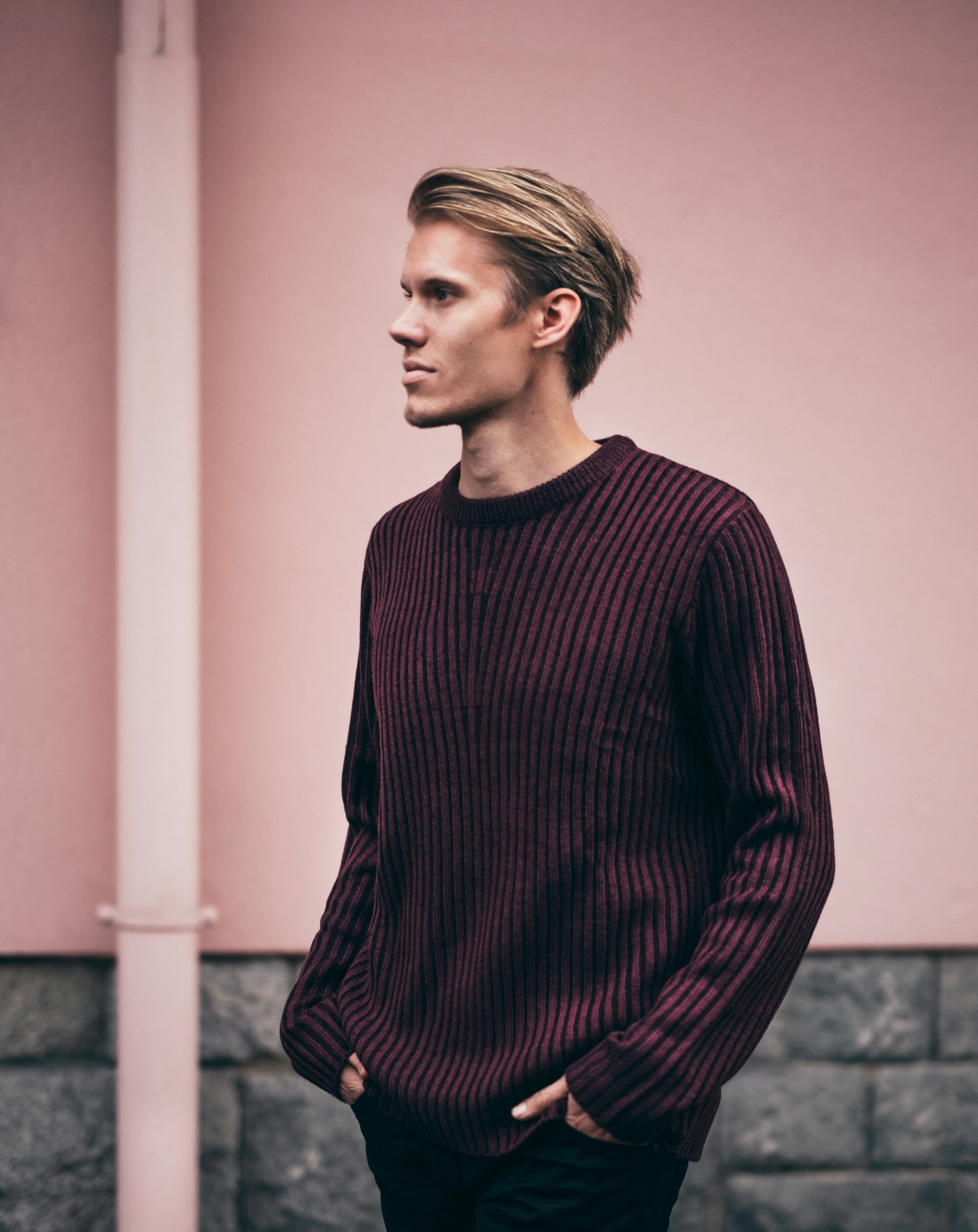 man in burgundy sweater