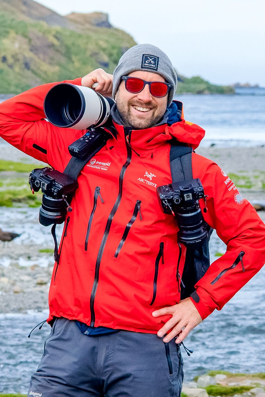 Espen photographer in Stavanger and Sandnes smiles with multiple cameras attached to his body