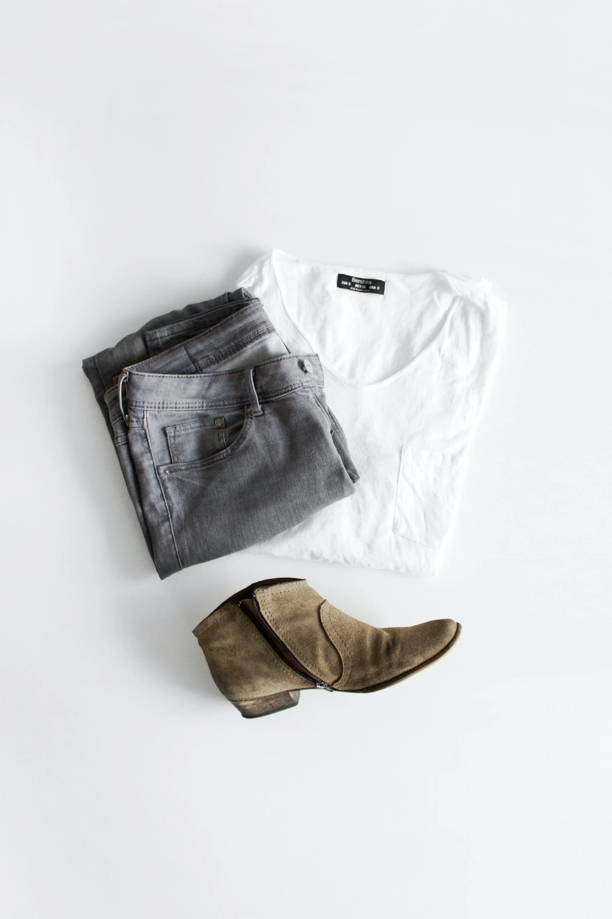 a pair of pants, a t-shirt, and boots