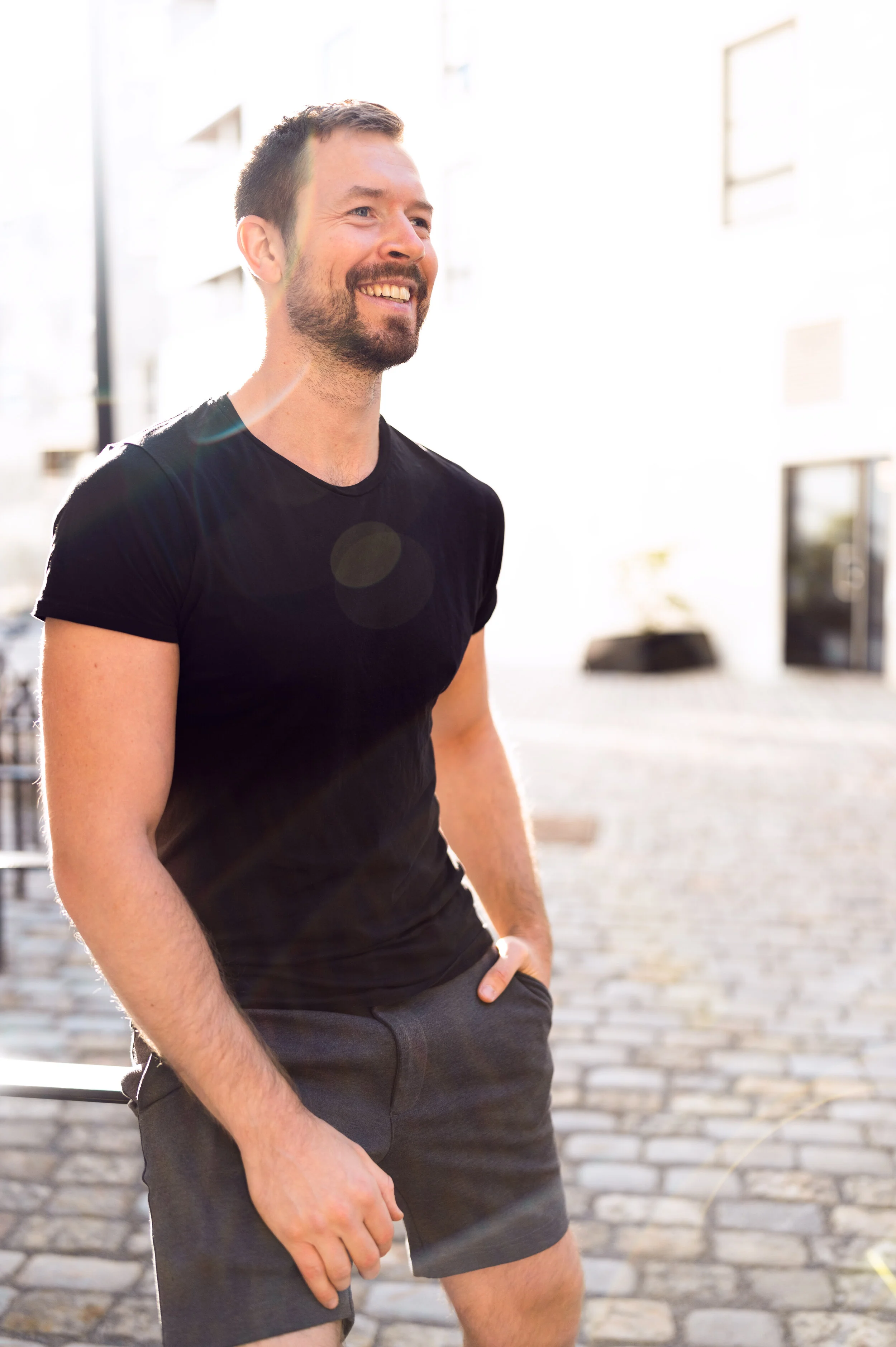 man laughing in shorts