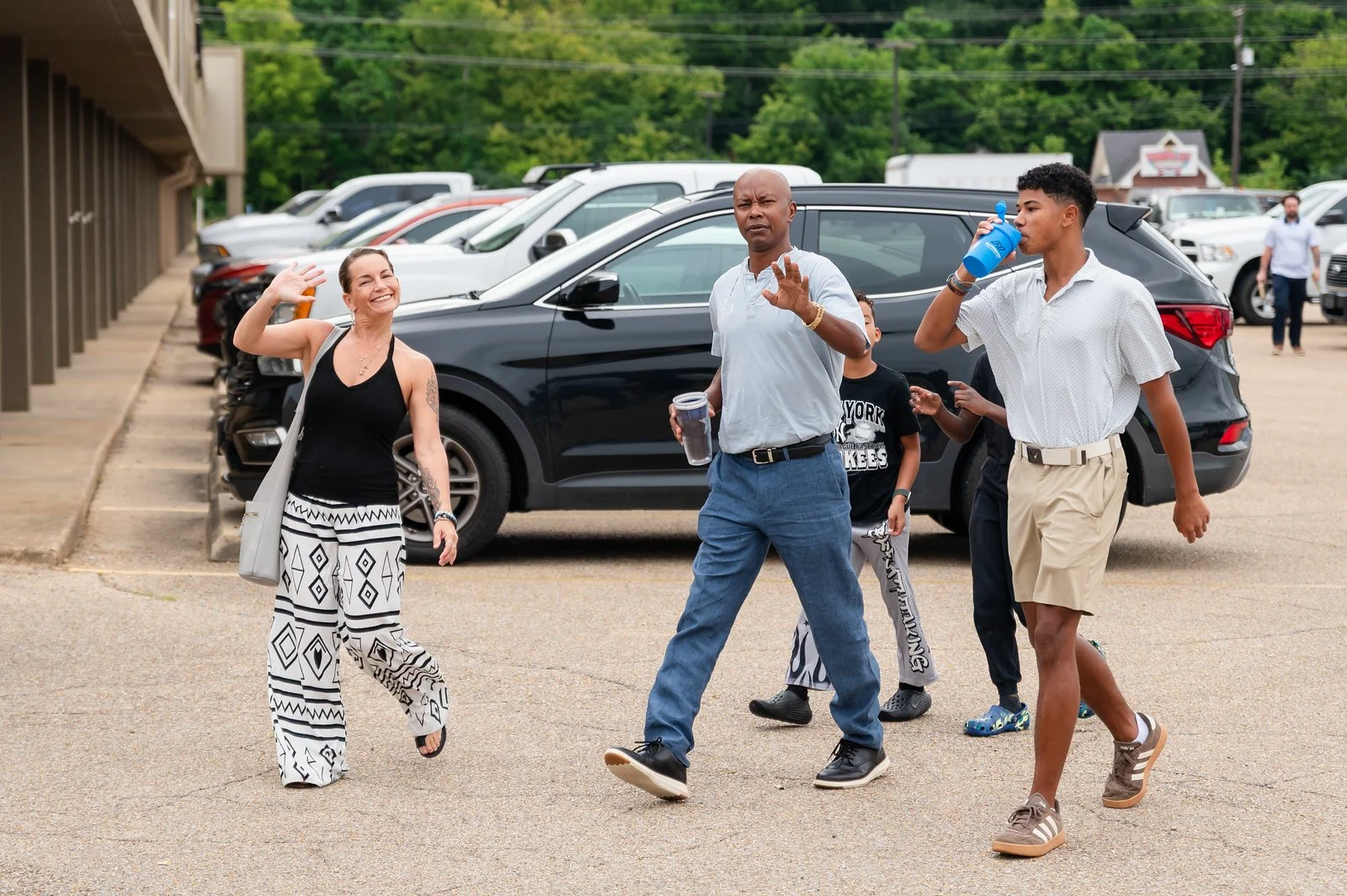 diverse family smiling and arriving at The Sycamore Church in Tupelo, MS / church in Tupelo, MS / churches in tupelo, ms