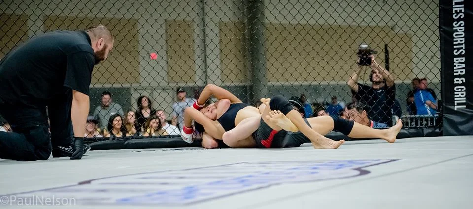 Emily Corso choking Katie Howard (again).jpg