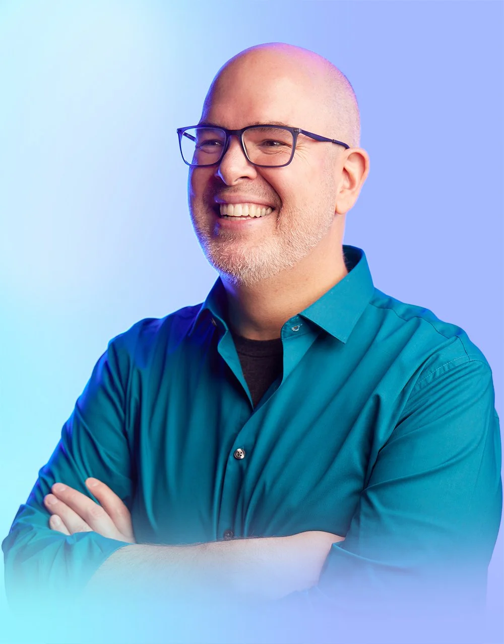 Portrait of a man looking to the left, smiling.