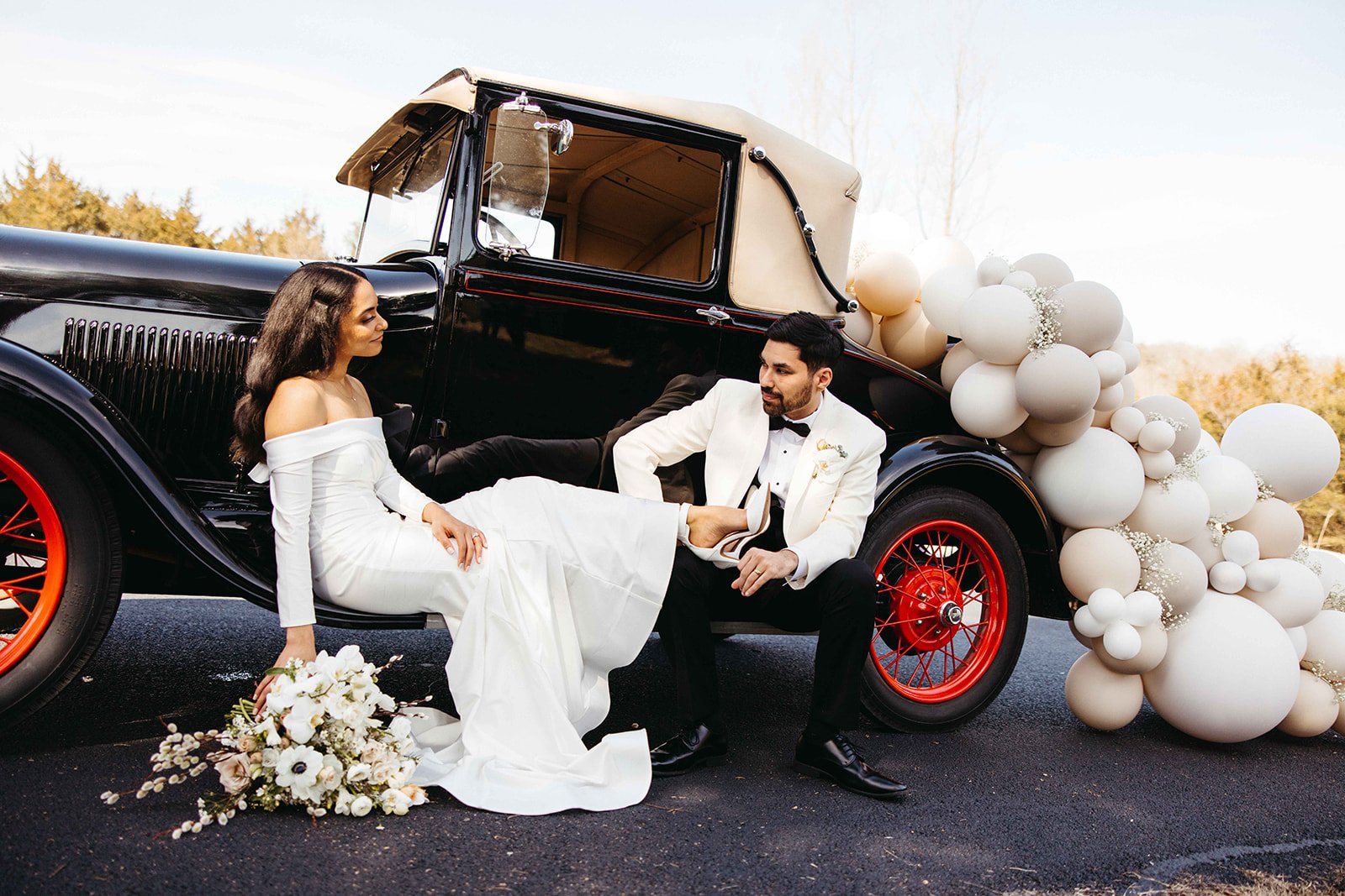 Bride and groom with vintage car Wedding Venues near Branson Missouri