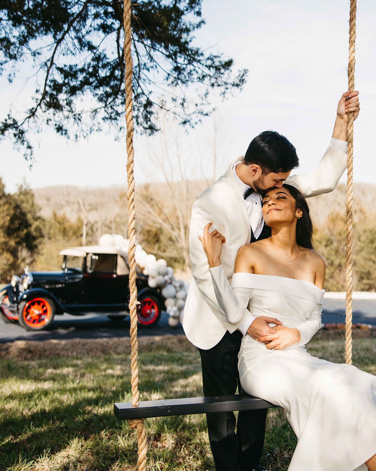 Wedding photo on a swing Ozark Mountain Wedding Venue