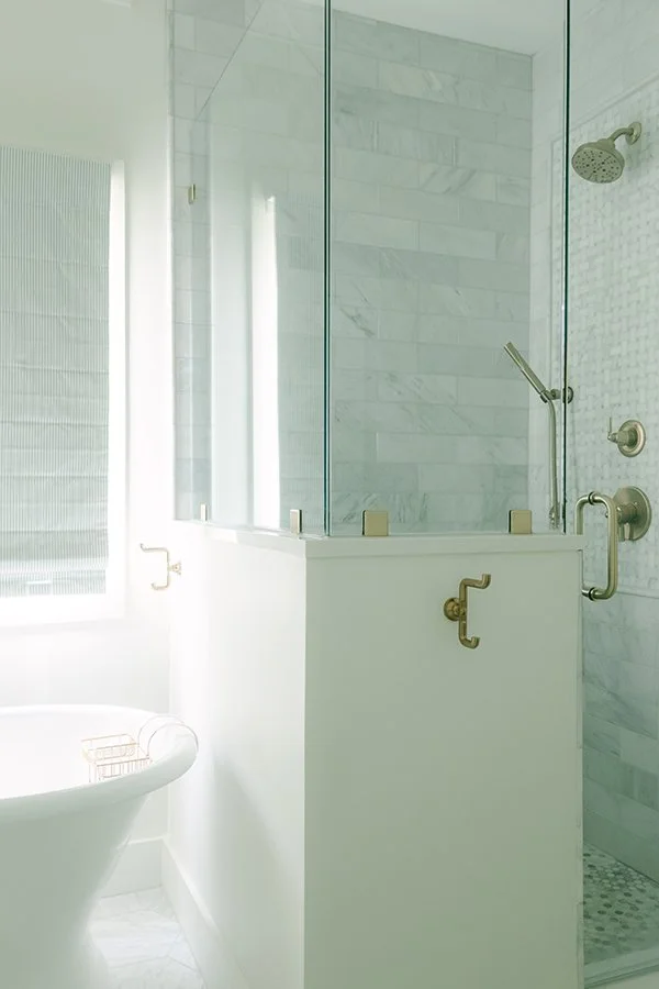 Shower with knee wall and glass enclosure