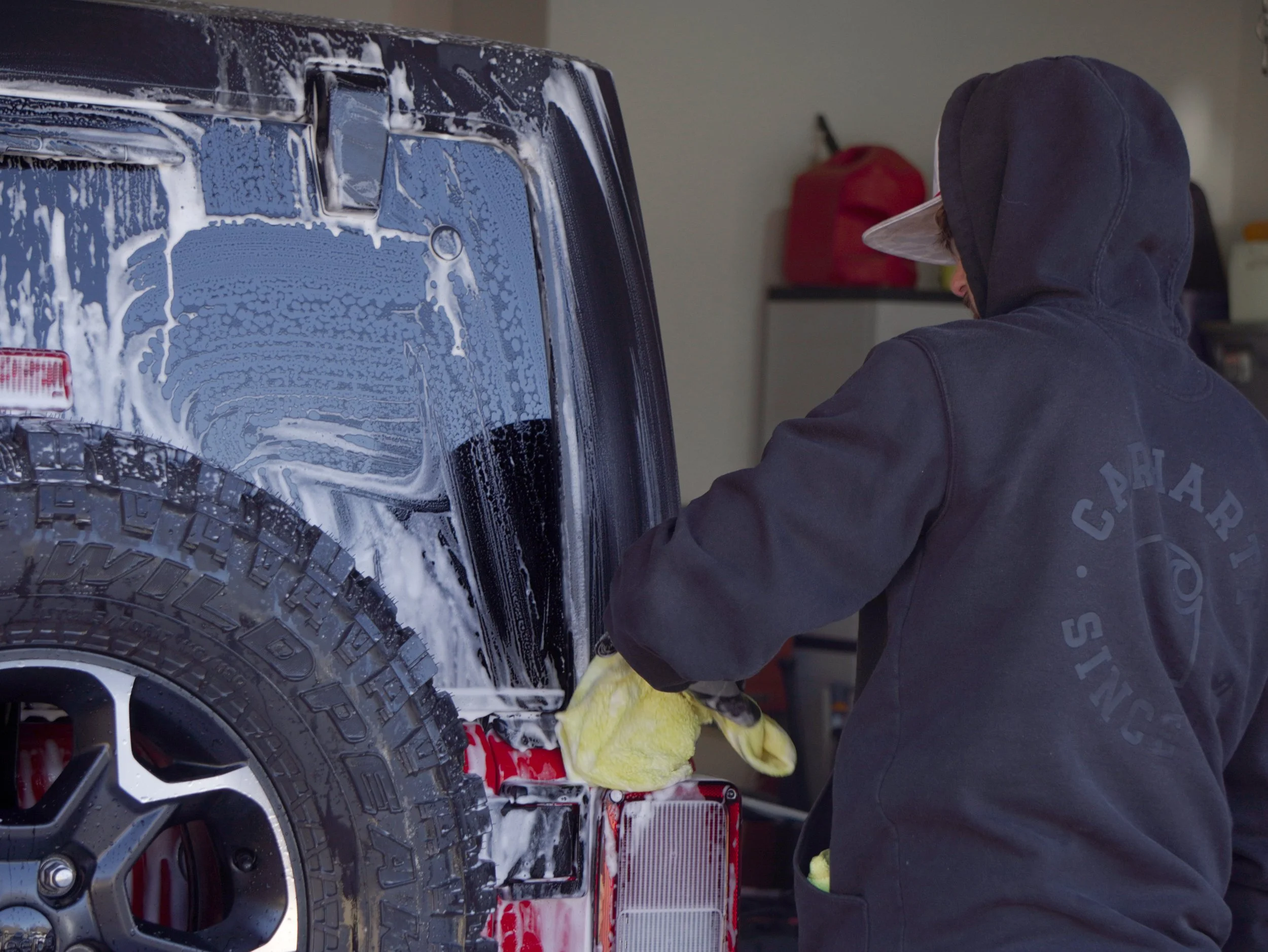 Handwashing the back of a jeep