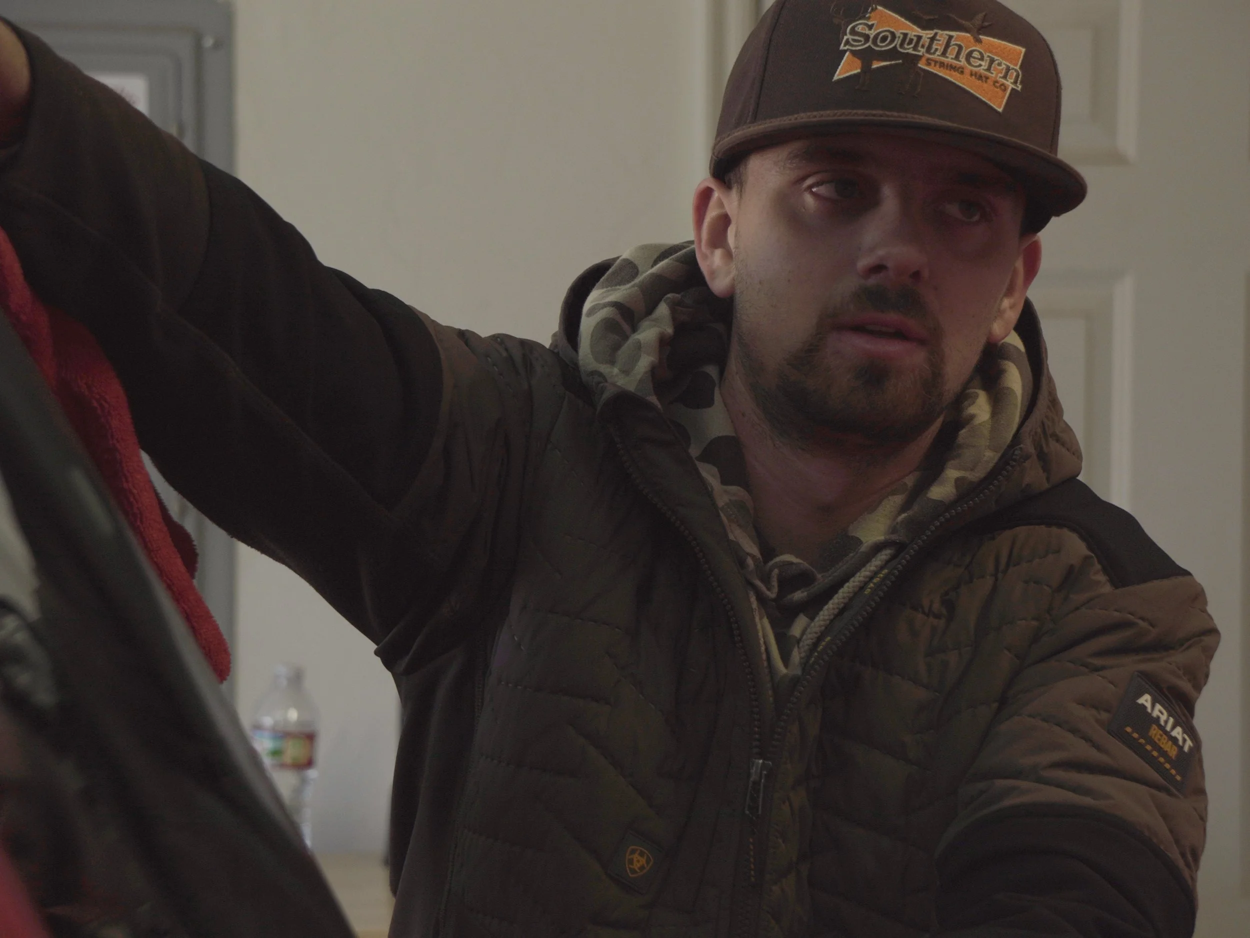 Dawson drying a vehicle with a microfiber cloth during an exterior detail