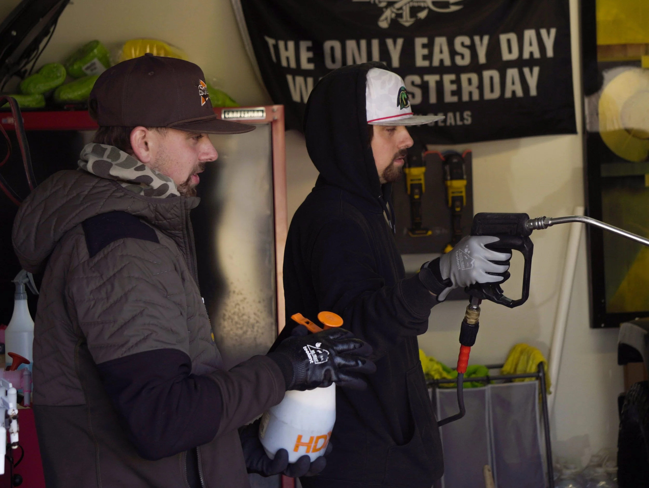 Dalton and Dawson working together to detail a vehicle at a customer's home