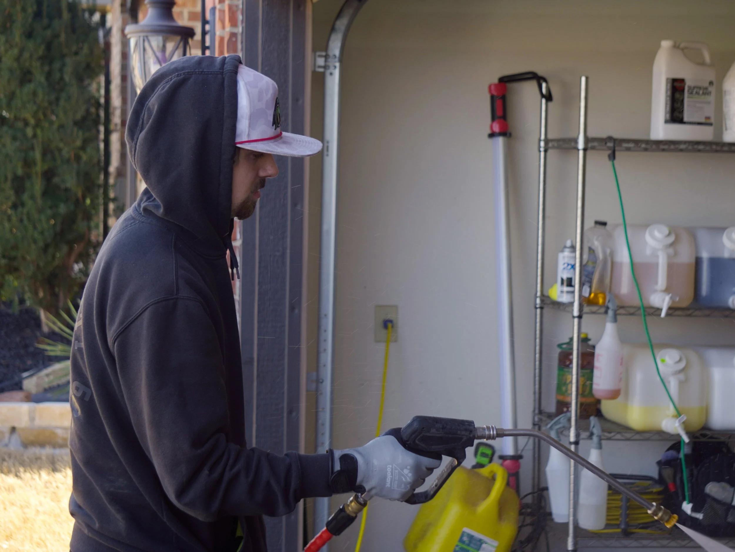 Dalton pressure washing a vehicle