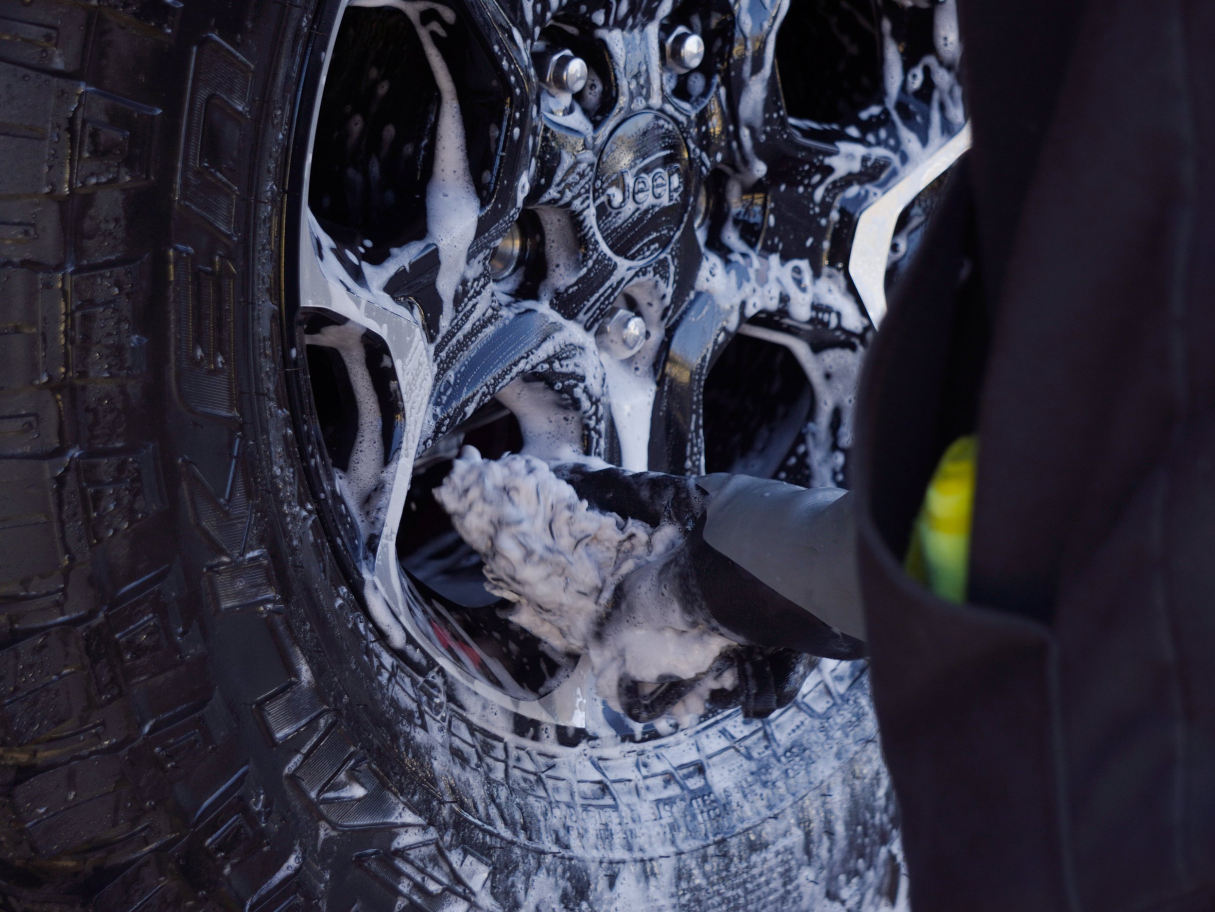 Carefully cleaning black wheels