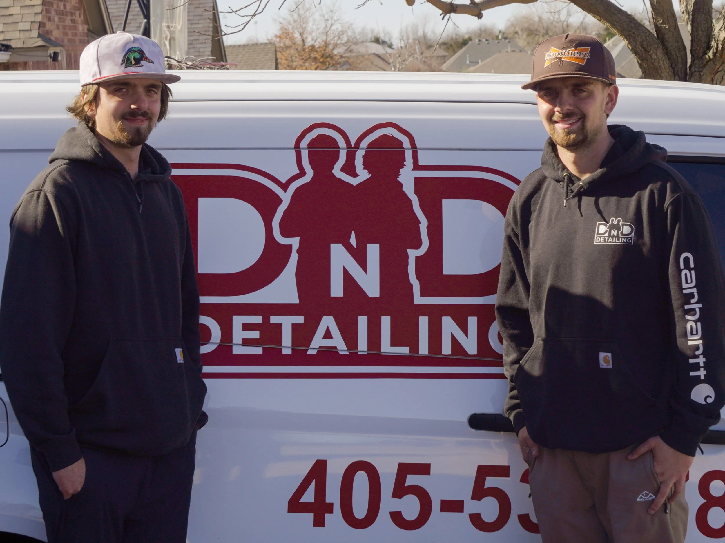 Dalton and Dawson, Founders of DnD Detailing standing in front of their service van
