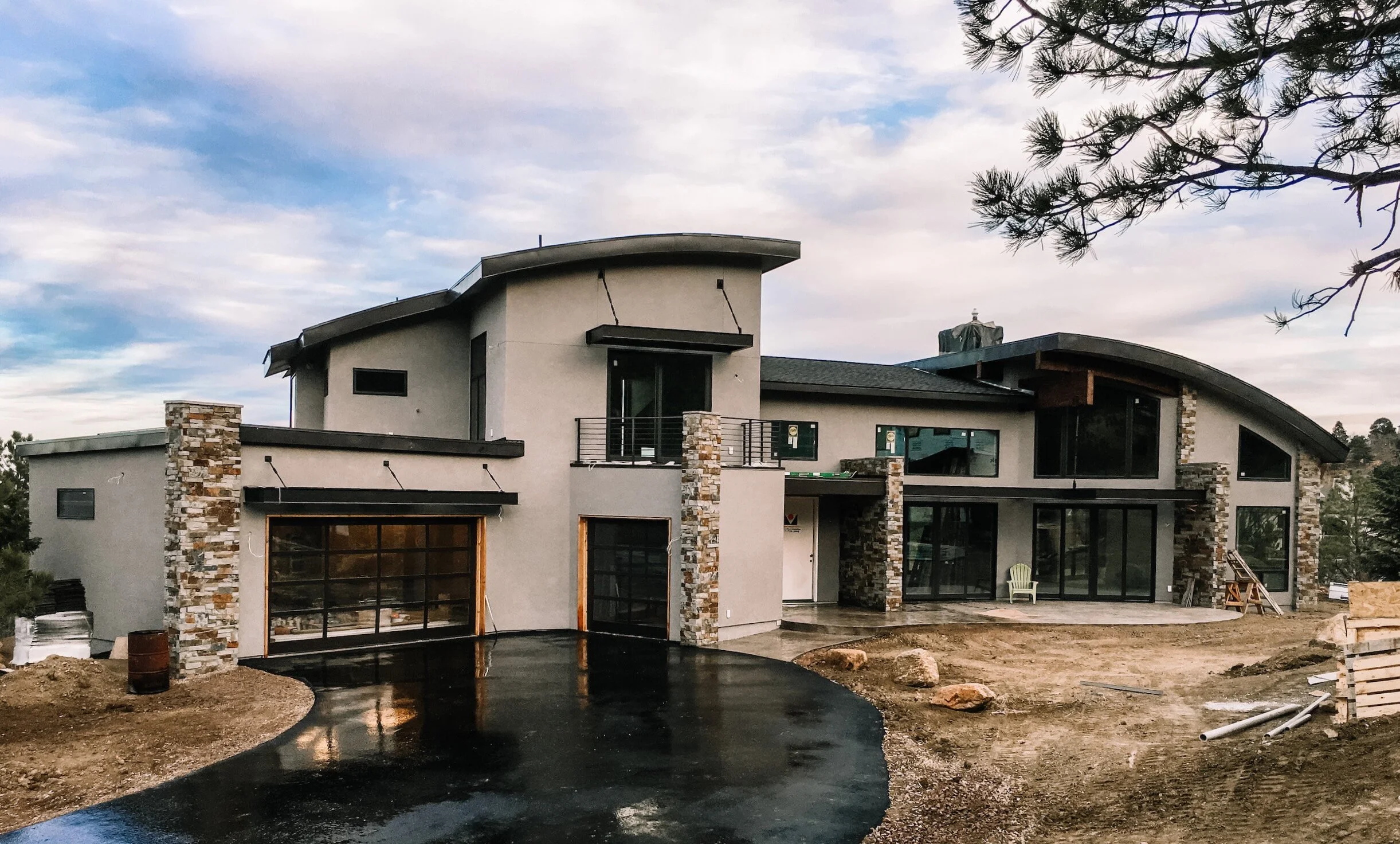 Colorado Springs contemporary custom home with curved roof.